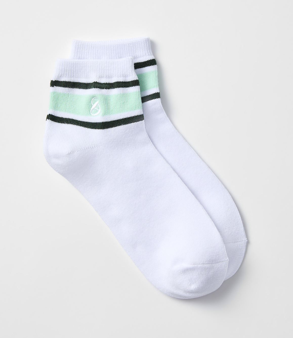 A pair of white ankle socks with mint green and black stripes and a small embroidered logo rests on a plain white background.