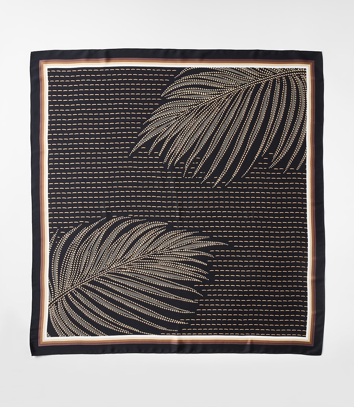 A dark square scarf with a pattern of two tan palm fronds against a background of horizontal dashed lines is bordered by thin stripes of white, brown, and black.