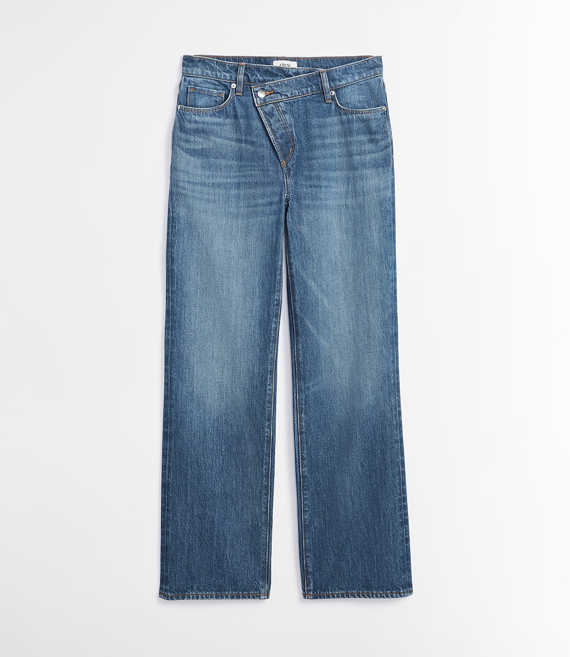 A pair of blue denim jeans with an asymmetrical waistband lies flat against a plain white background.