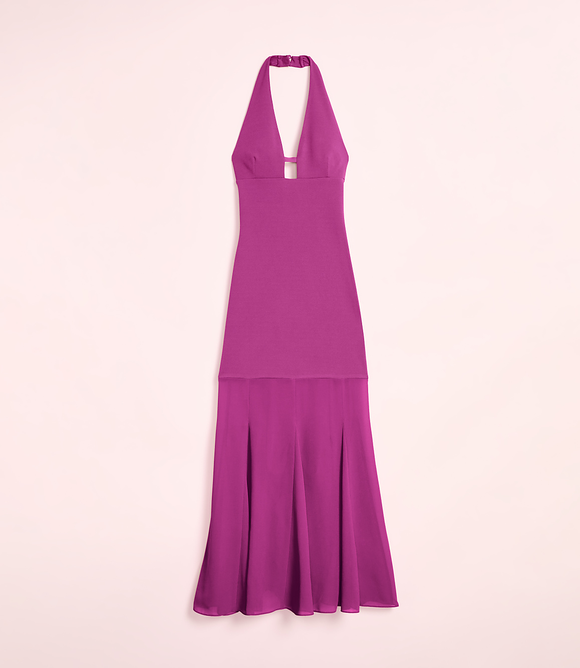A fuchsia halter dress with a keyhole neckline and a flowing skirt is displayed against a soft pink background.