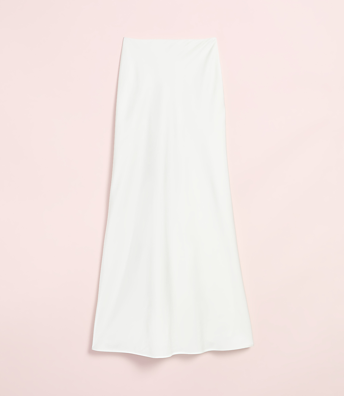 A white, flowing skirt hangs against a soft pink background.