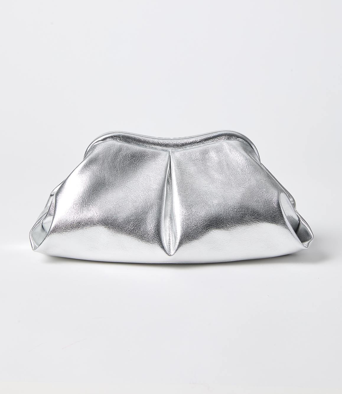 A silver metallic clutch bag with soft pleats sits on a plain white background.