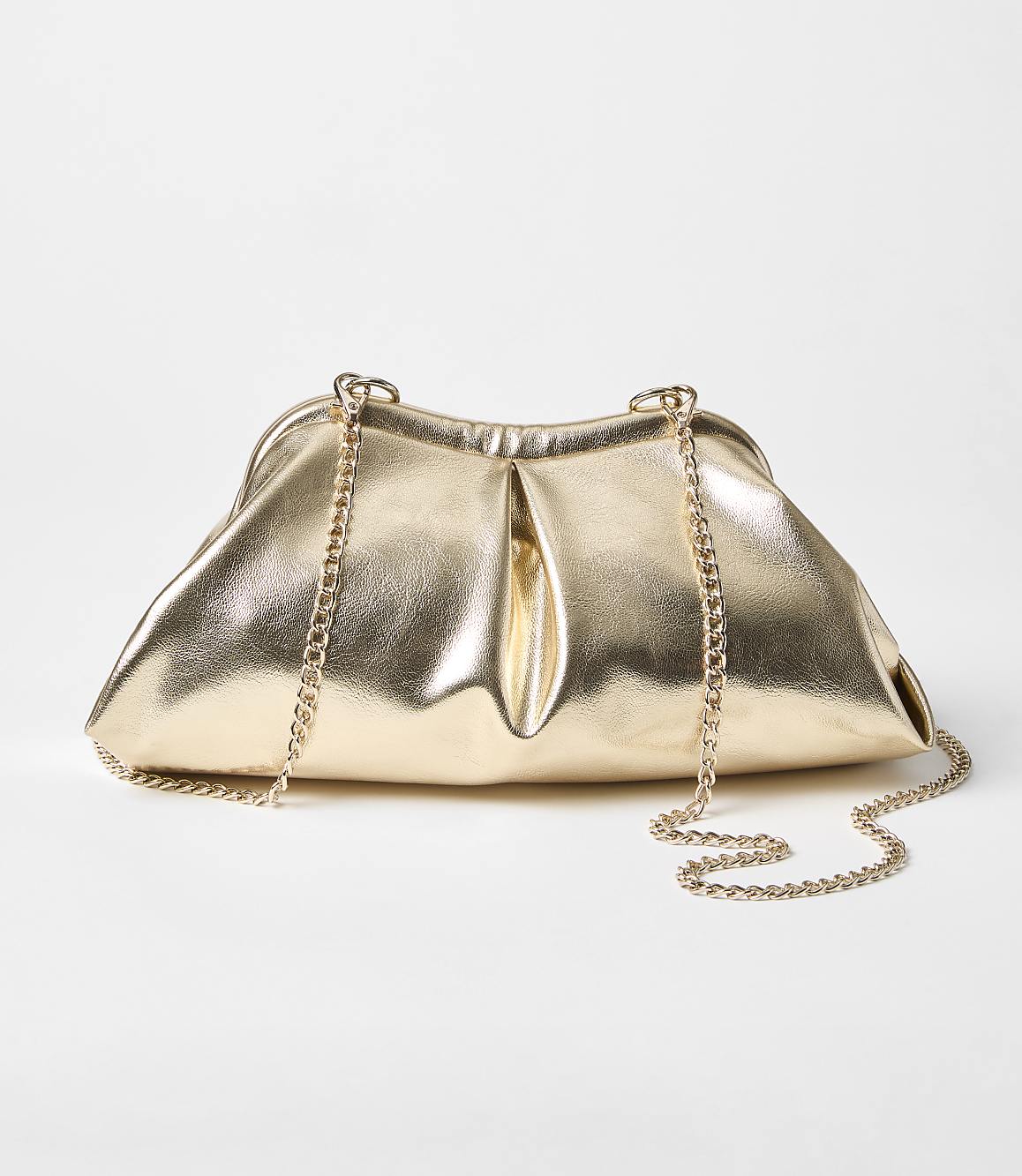 A metallic gold clutch with a delicate chain strap rests on a plain white background.