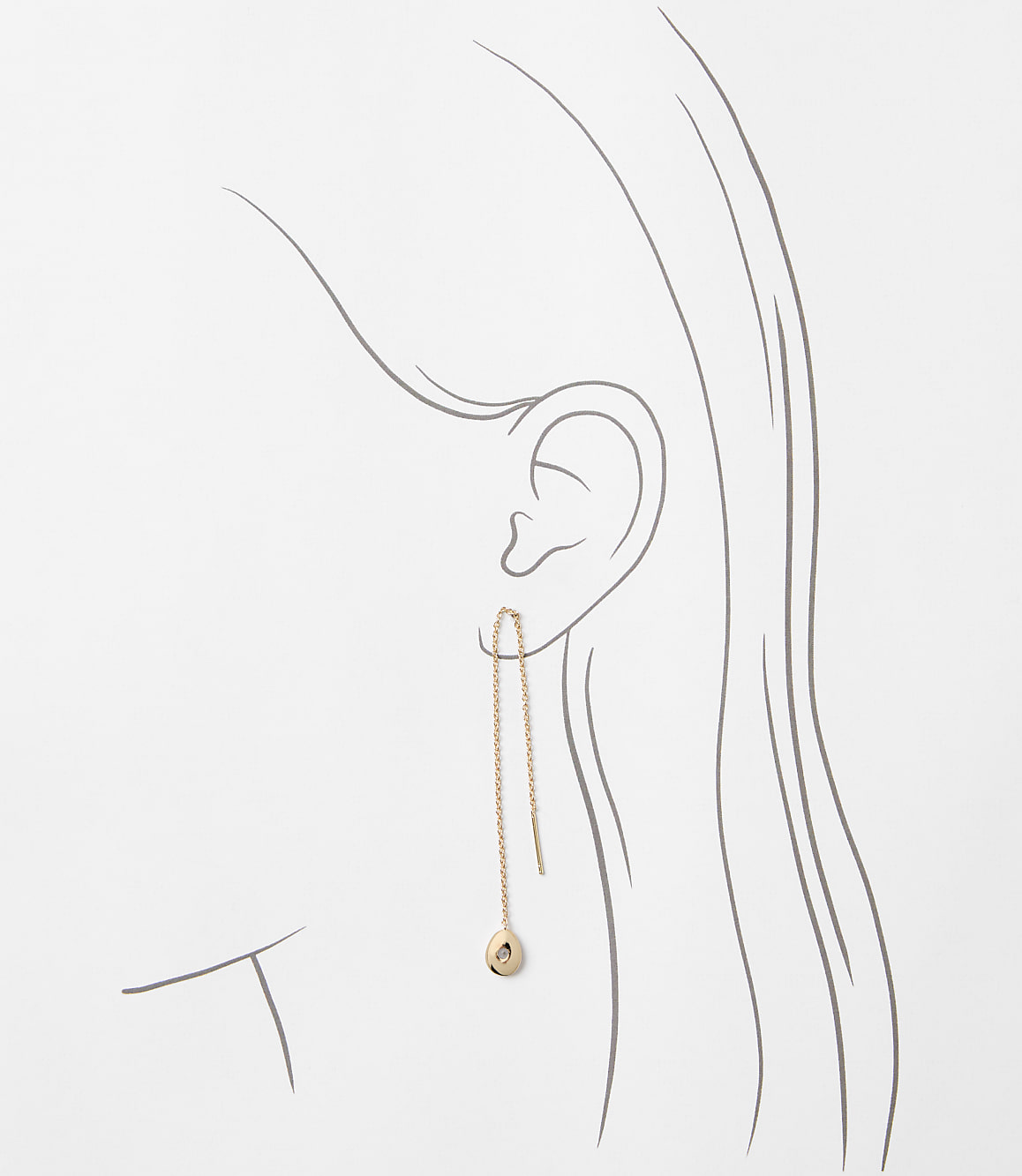 A delicate rose gold threader earring with a small charm dangles from an ear, set against a minimalist line drawing of a woman's head and neck.