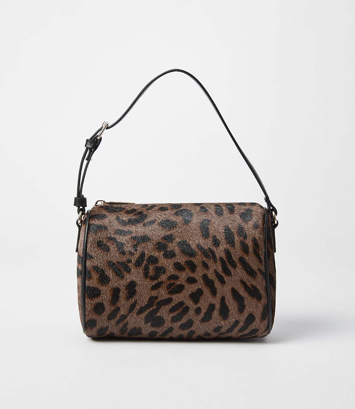A leopard-print shoulder bag with a black strap rests on a plain white background.