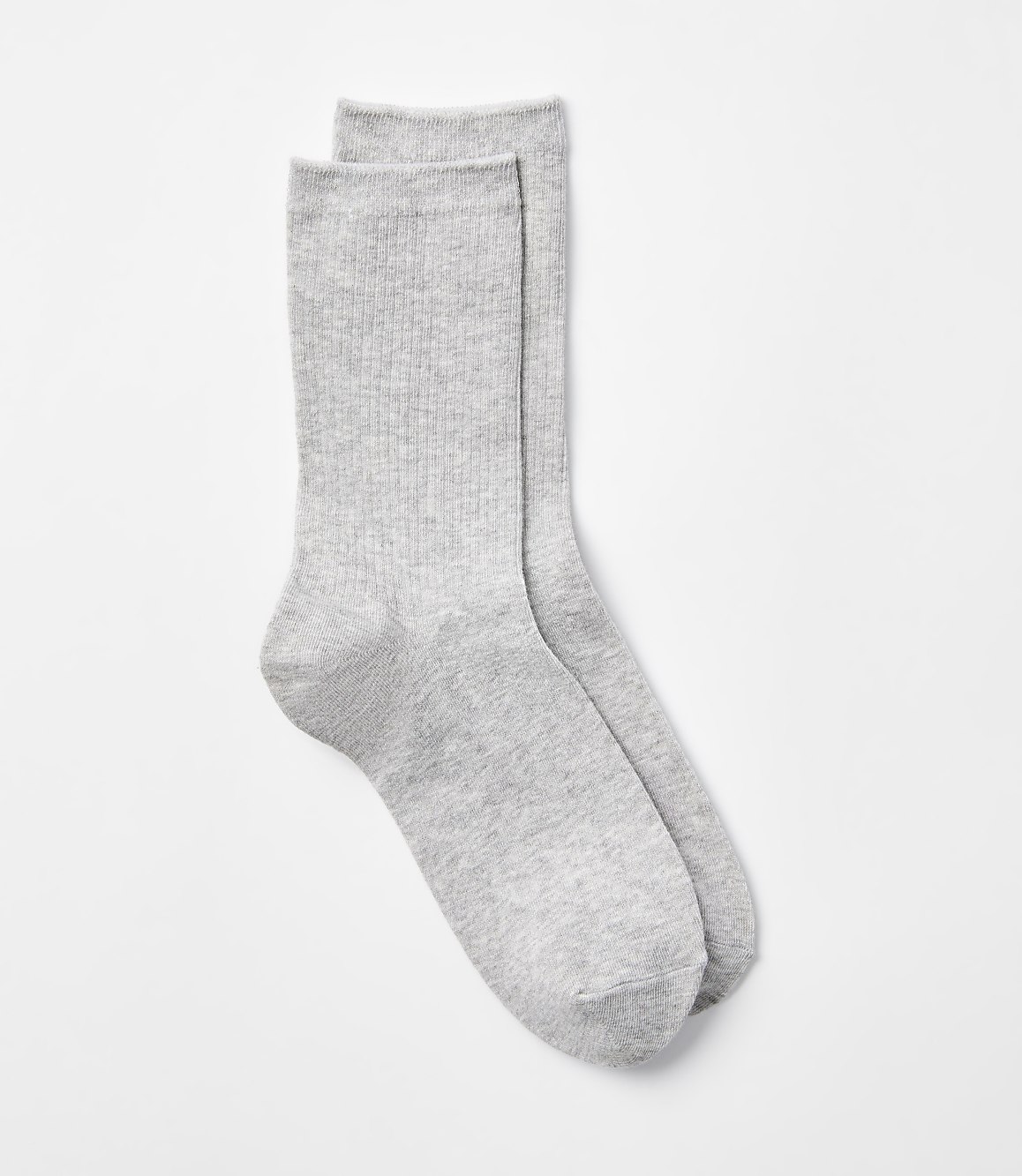 A pair of light gray ribbed socks lies on a plain white background.
