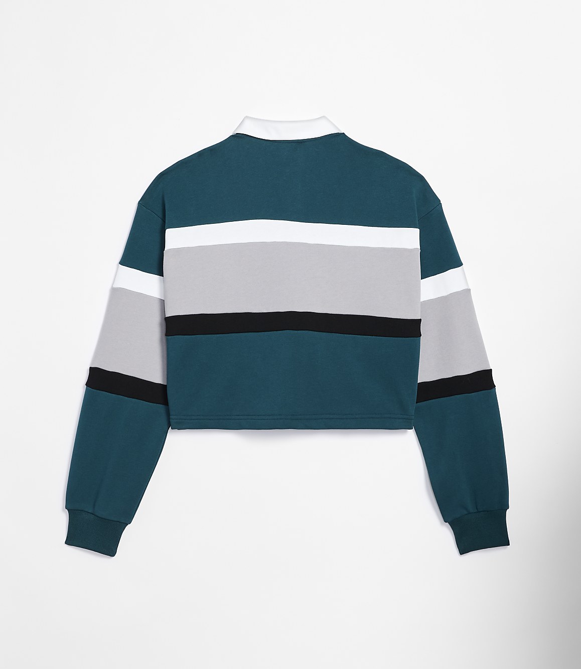 A cropped, long-sleeved rugby shirt with teal, white, gray, and black stripes is displayed against a plain white background.