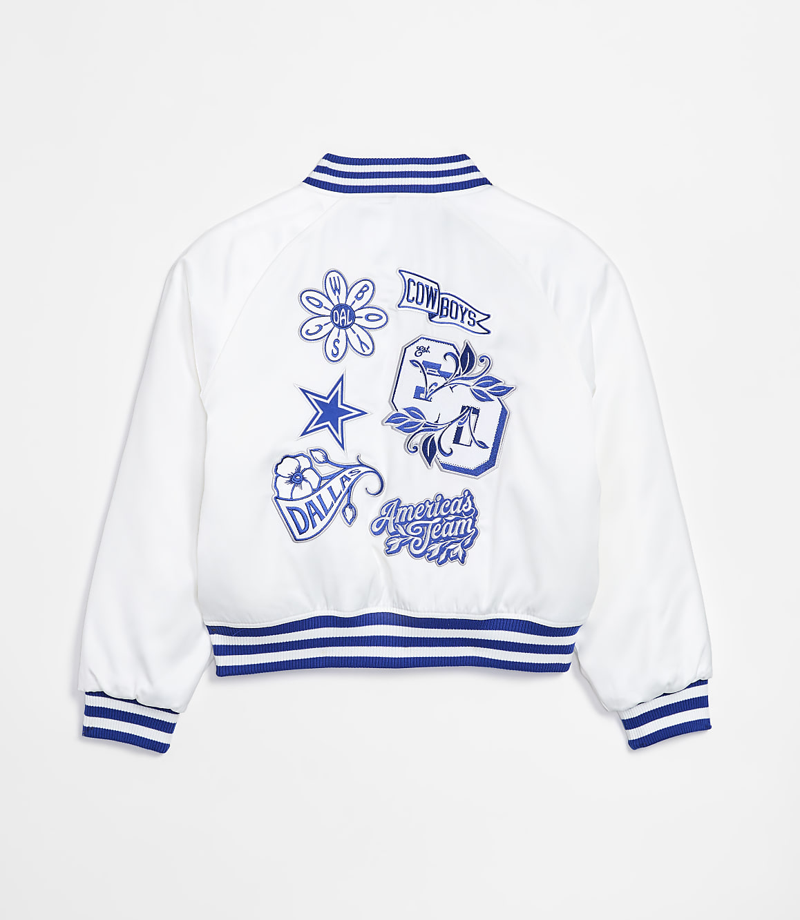 A white bomber jacket with blue trim and embroidered Dallas Cowboys patches is displayed against a plain white background.