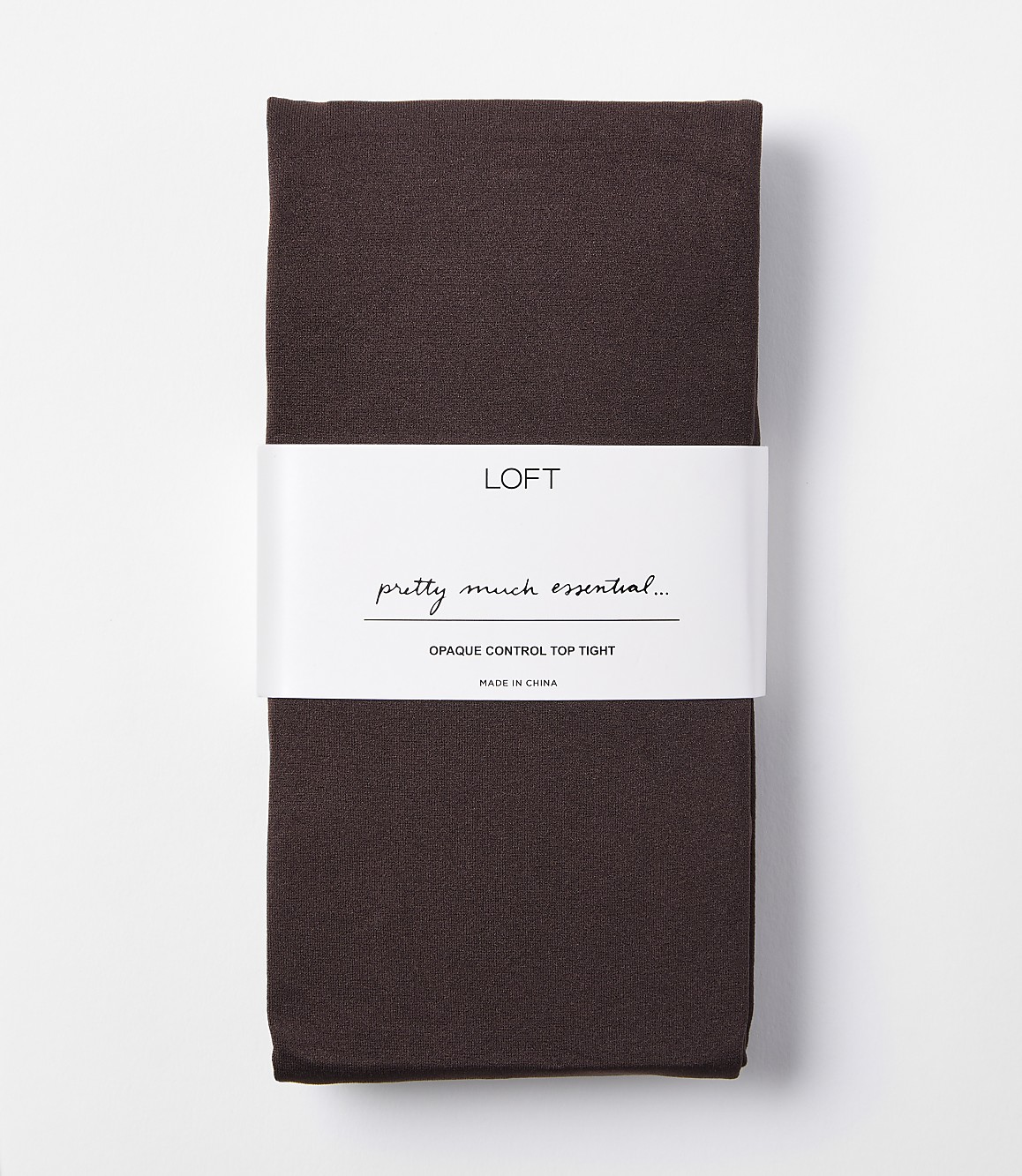 A pair of dark brown opaque control top tights are folded and banded with a white label that reads "LOFT pretty much essential... OPAQUE CONTROL TOP TIGHT" against a plain white background.