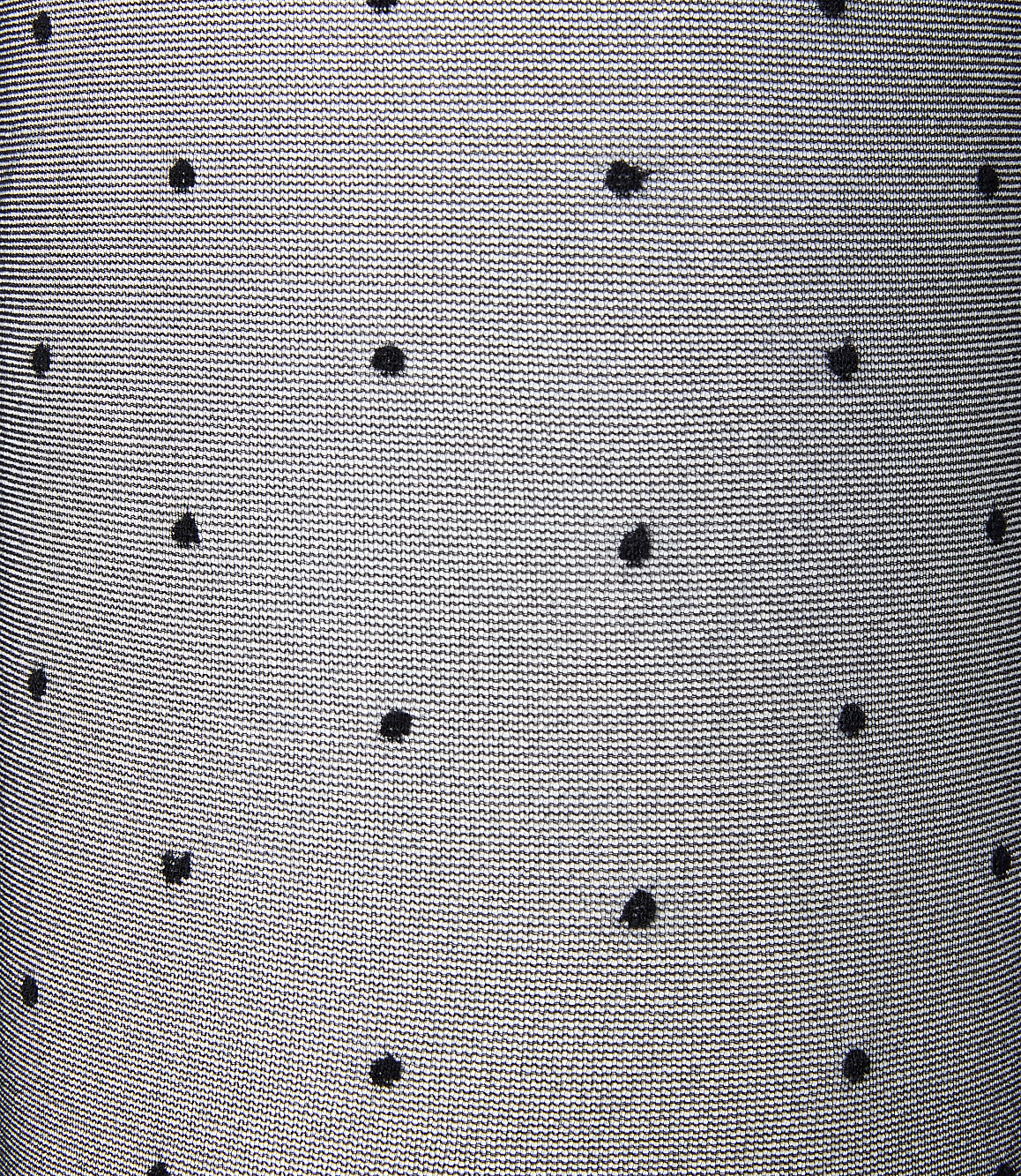 Black polka dots are scattered across a textured, light gray fabric background.