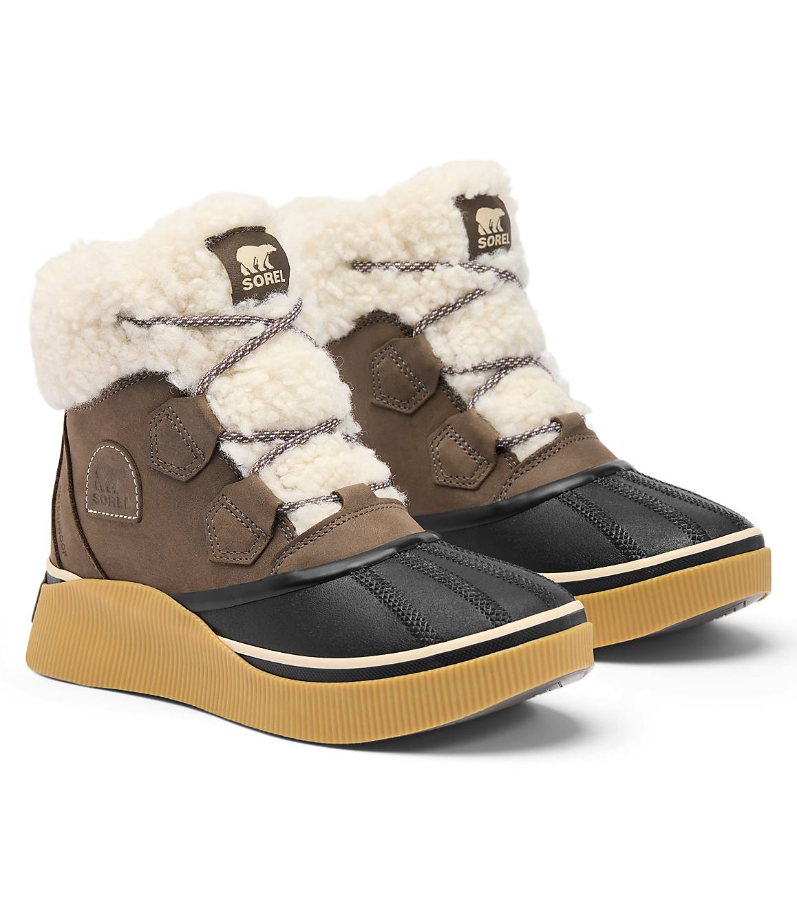 A pair of brown and black winter boots with fluffy white lining and tan soles are displayed against a plain white background.