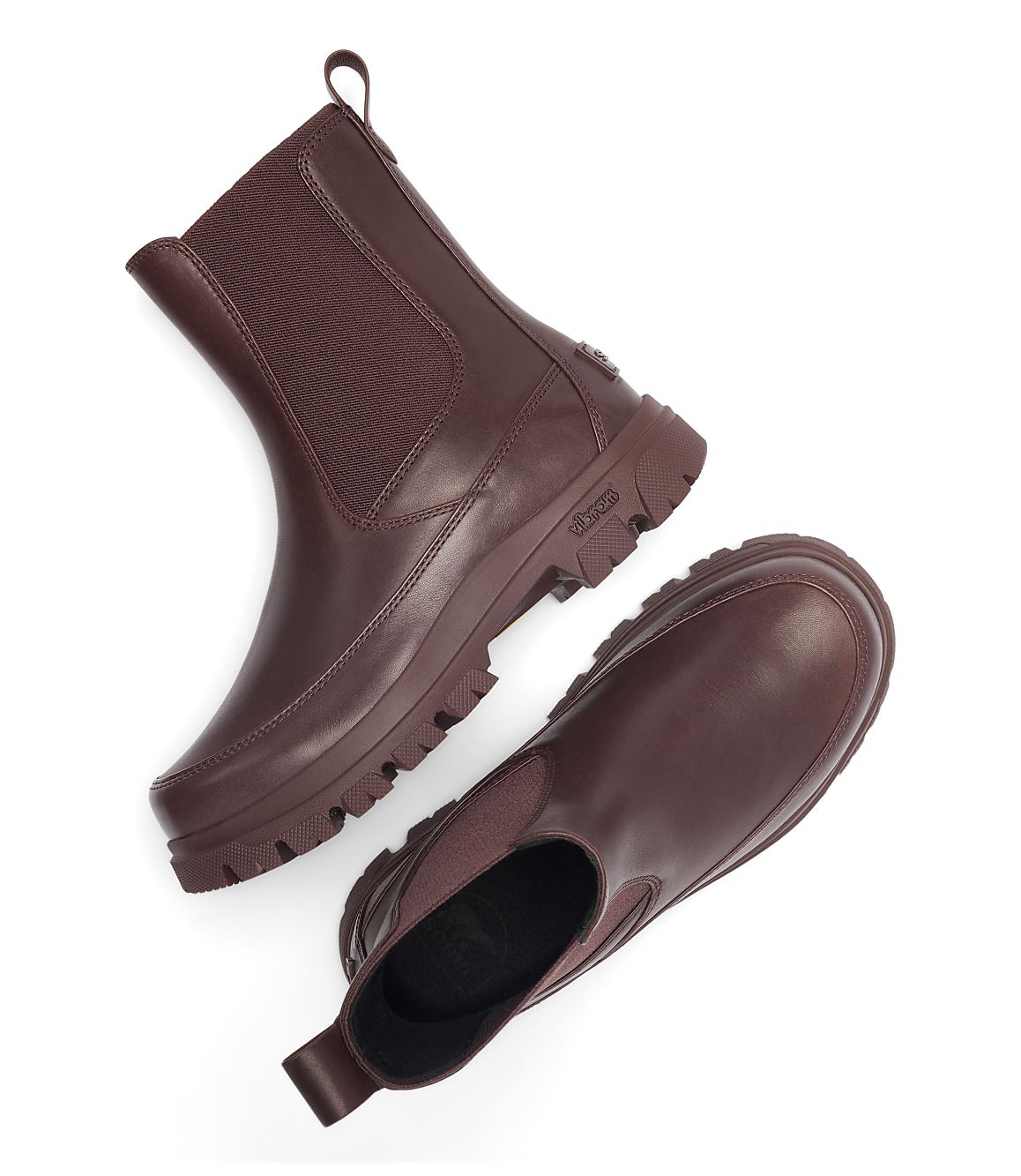 A pair of brown leather Chelsea boots with thick soles are arranged on a white background.