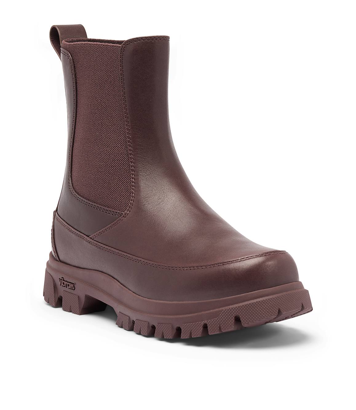 A burgundy Chelsea boot with a thick lug sole stands against a plain white background.