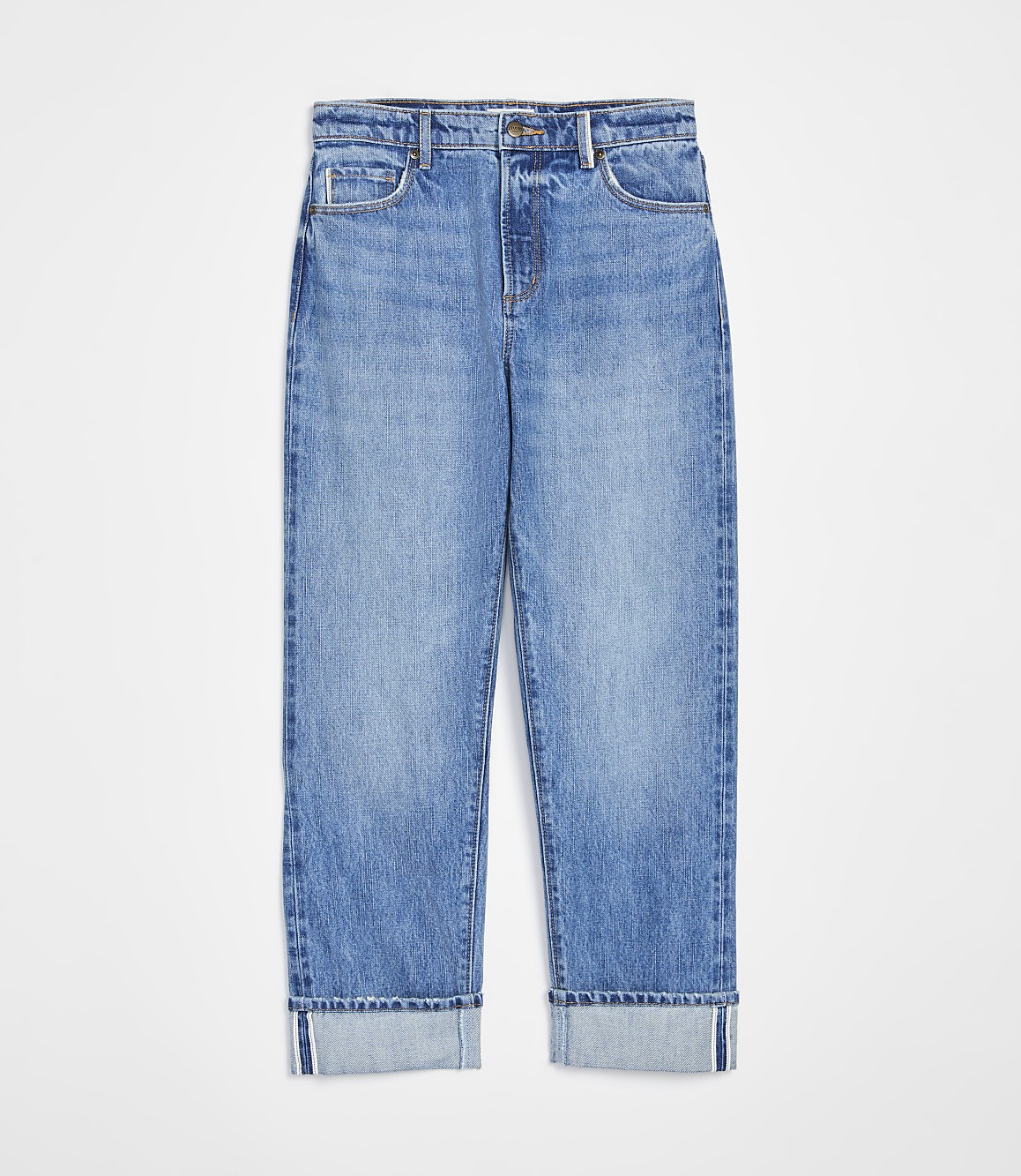 A pair of cuffed light-wash denim jeans are displayed against a plain white background.