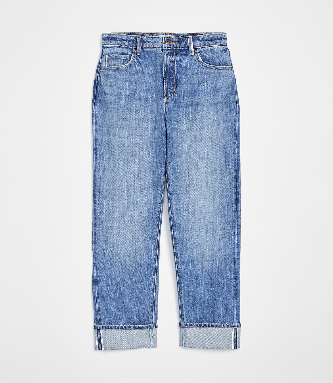 A pair of cuffed light-wash denim jeans are displayed against a plain white background.