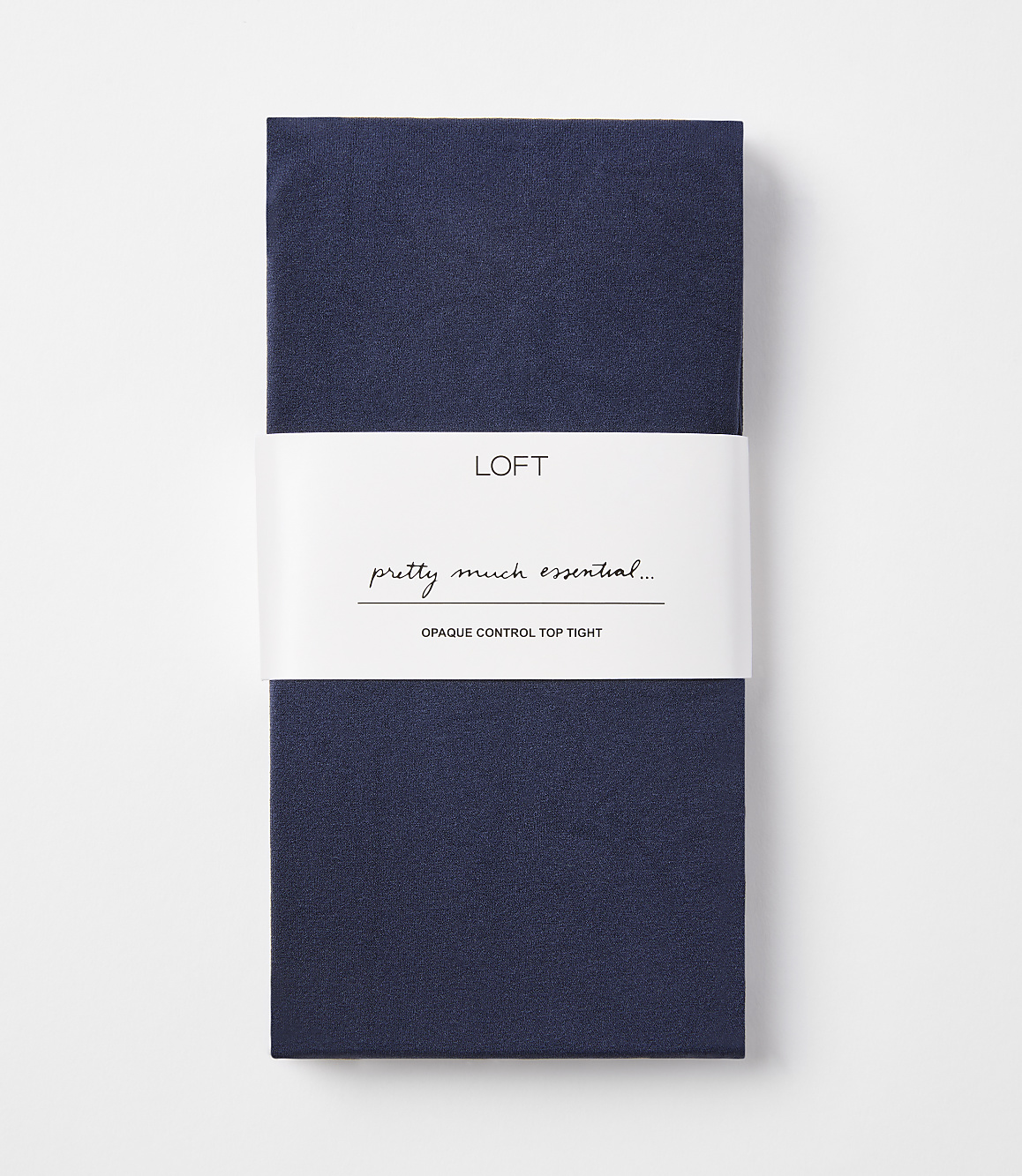 A folded pair of navy blue opaque control top tights with a white band in the middle featuring the "LOFT" logo and text, against a plain white background.