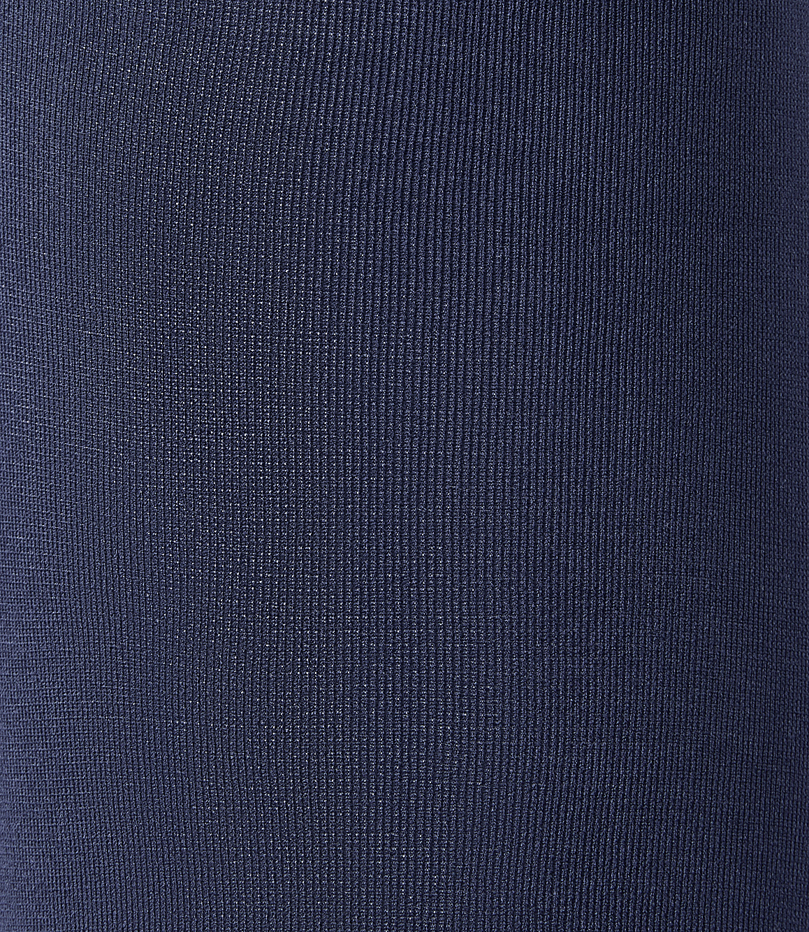A close-up view of dark blue ribbed fabric fills the frame, with no discernible background.