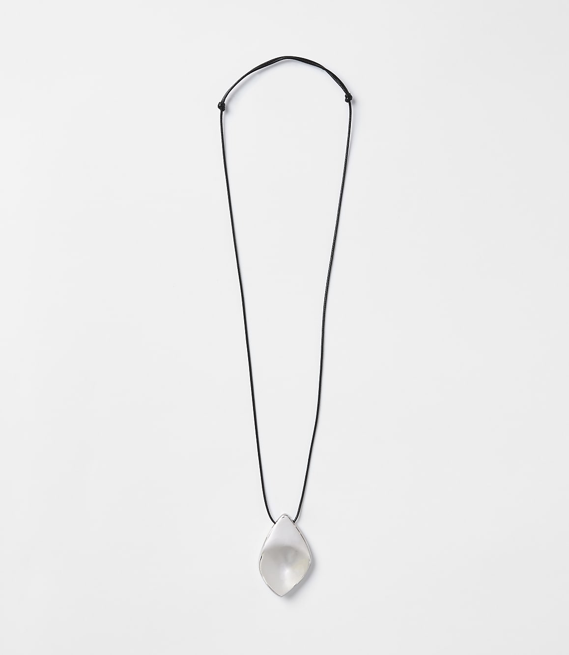 A translucent, teardrop-shaped pendant hangs from a thin black cord against a plain white background.