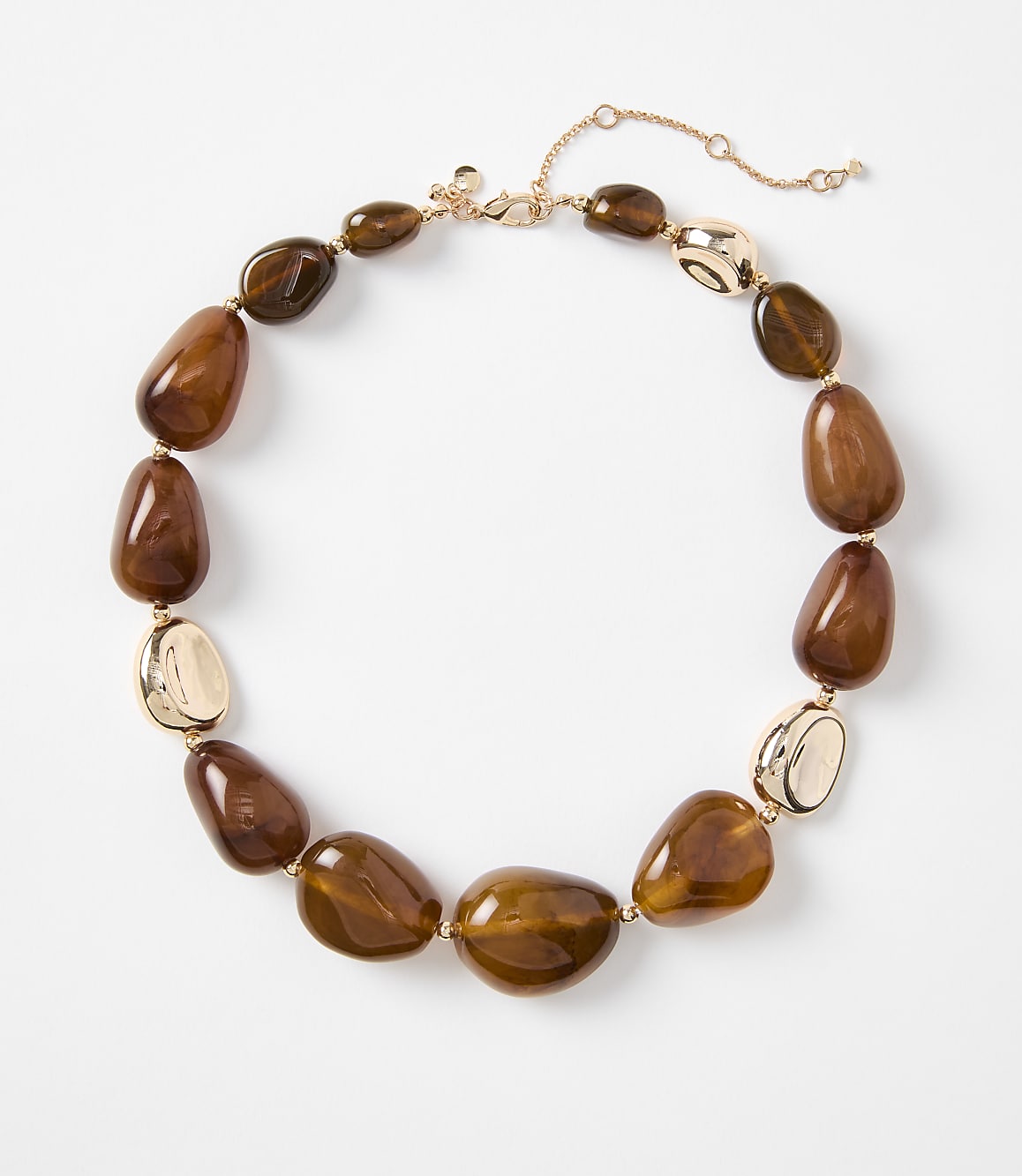 A chunky brown beaded necklace with gold accents rests on a plain white background.