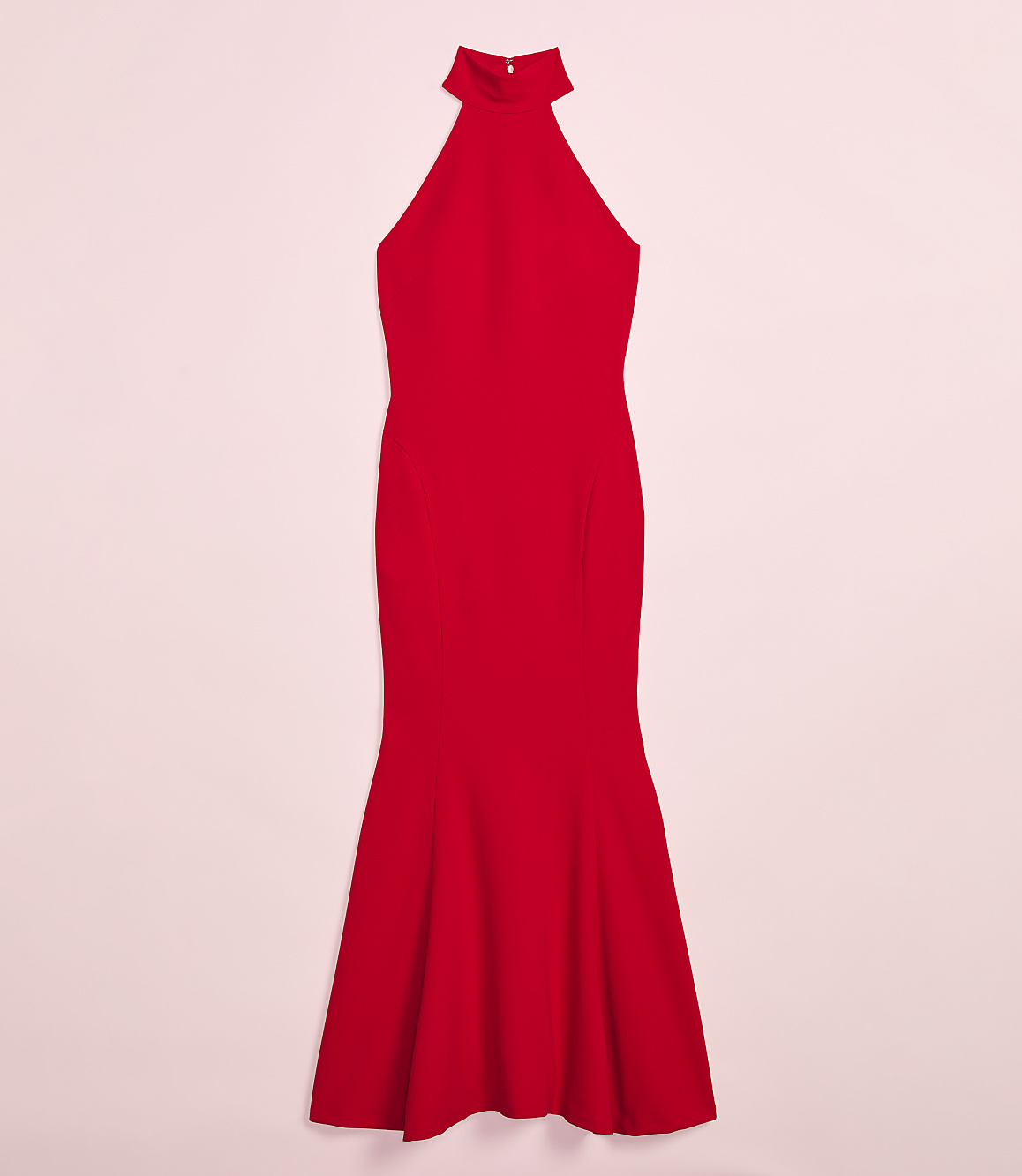 A vibrant red, floor-length halter dress with a flared hemline is presented against a soft pink background.