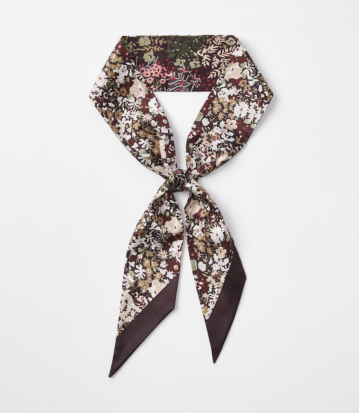 A floral print skinny scarf is tied in a knot against a plain white background.