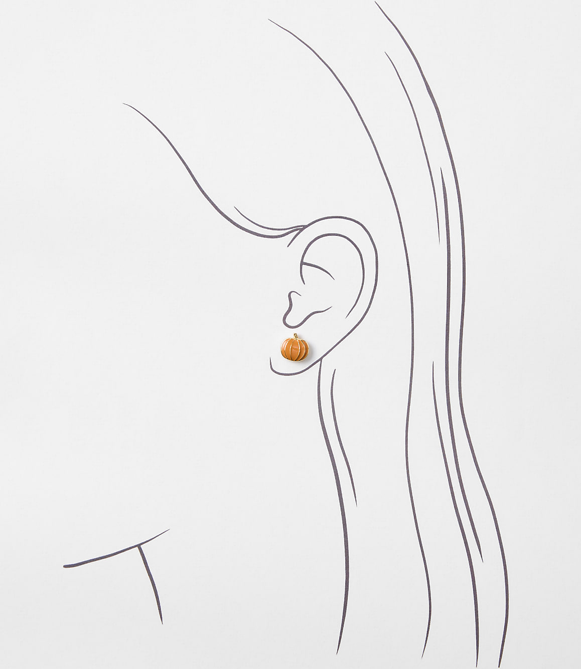 A small, orange pumpkin earring is worn on a stylized ear, set against a plain white background.