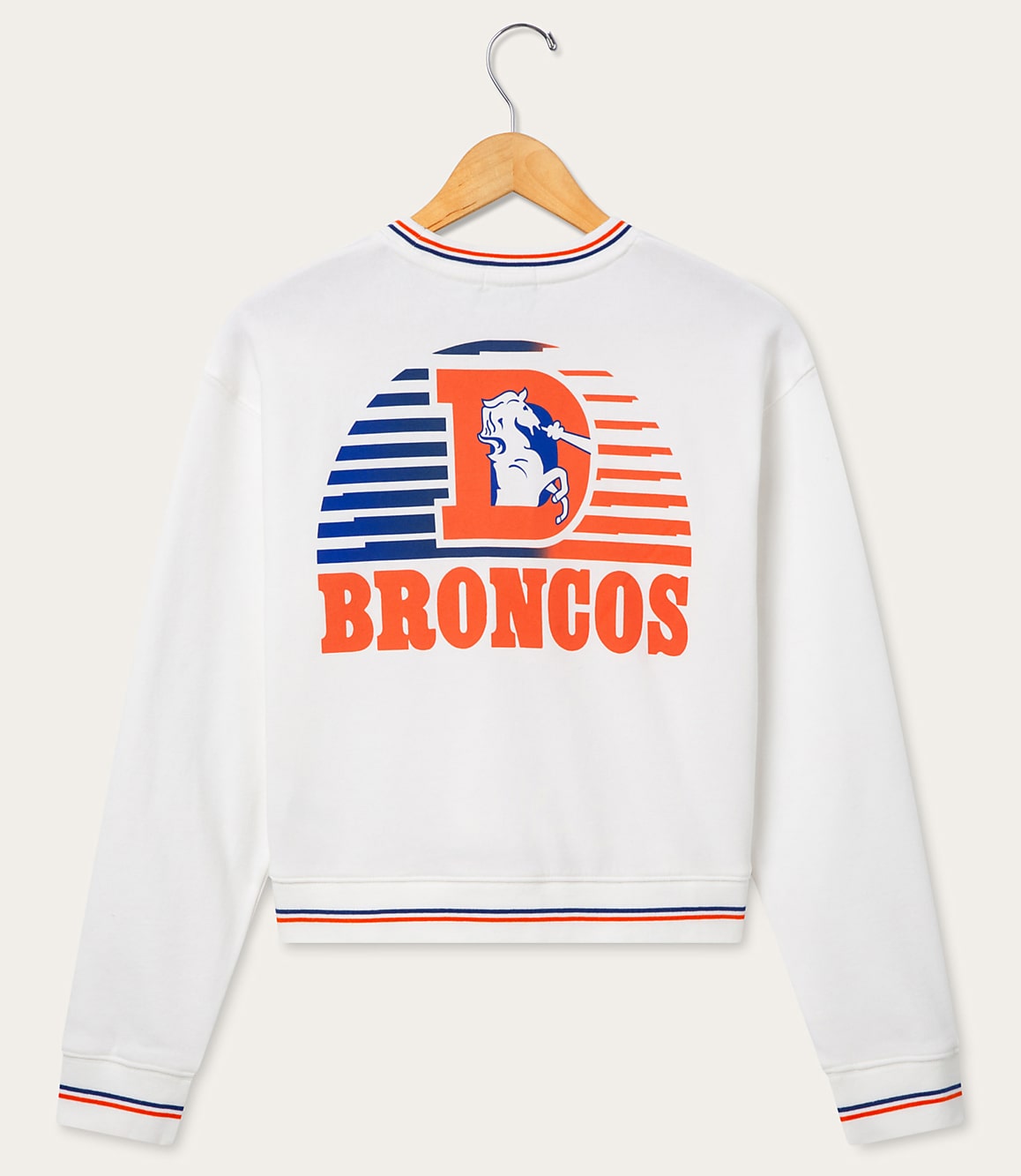 A white sweatshirt with the Denver Broncos logo and name is displayed on a hanger against a plain white background.