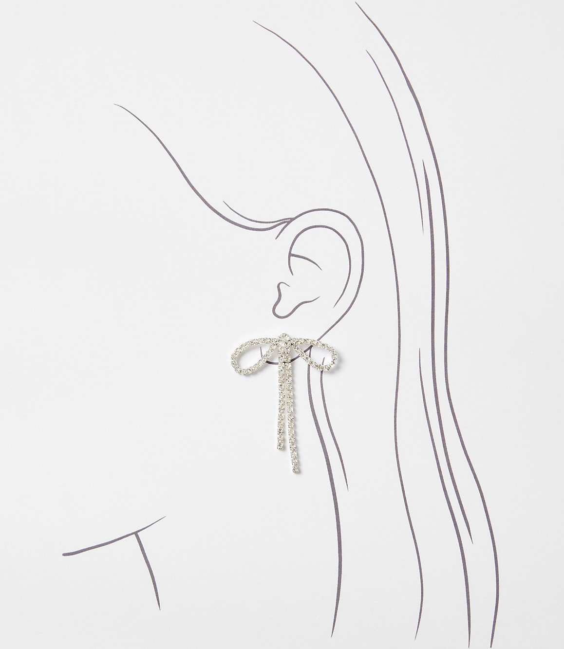 A sparkling bow earring with dangling chains adorns an illustrated ear against a plain white background.