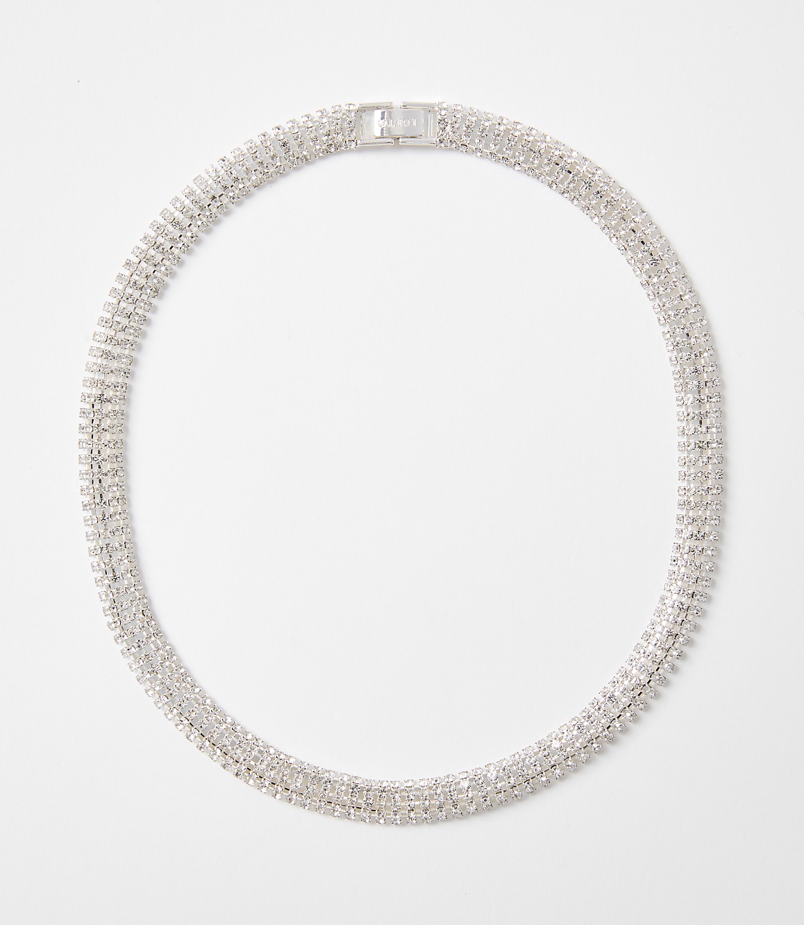 A sparkling, multi-layered rhinestone necklace with a silver clasp rests on a plain white background.