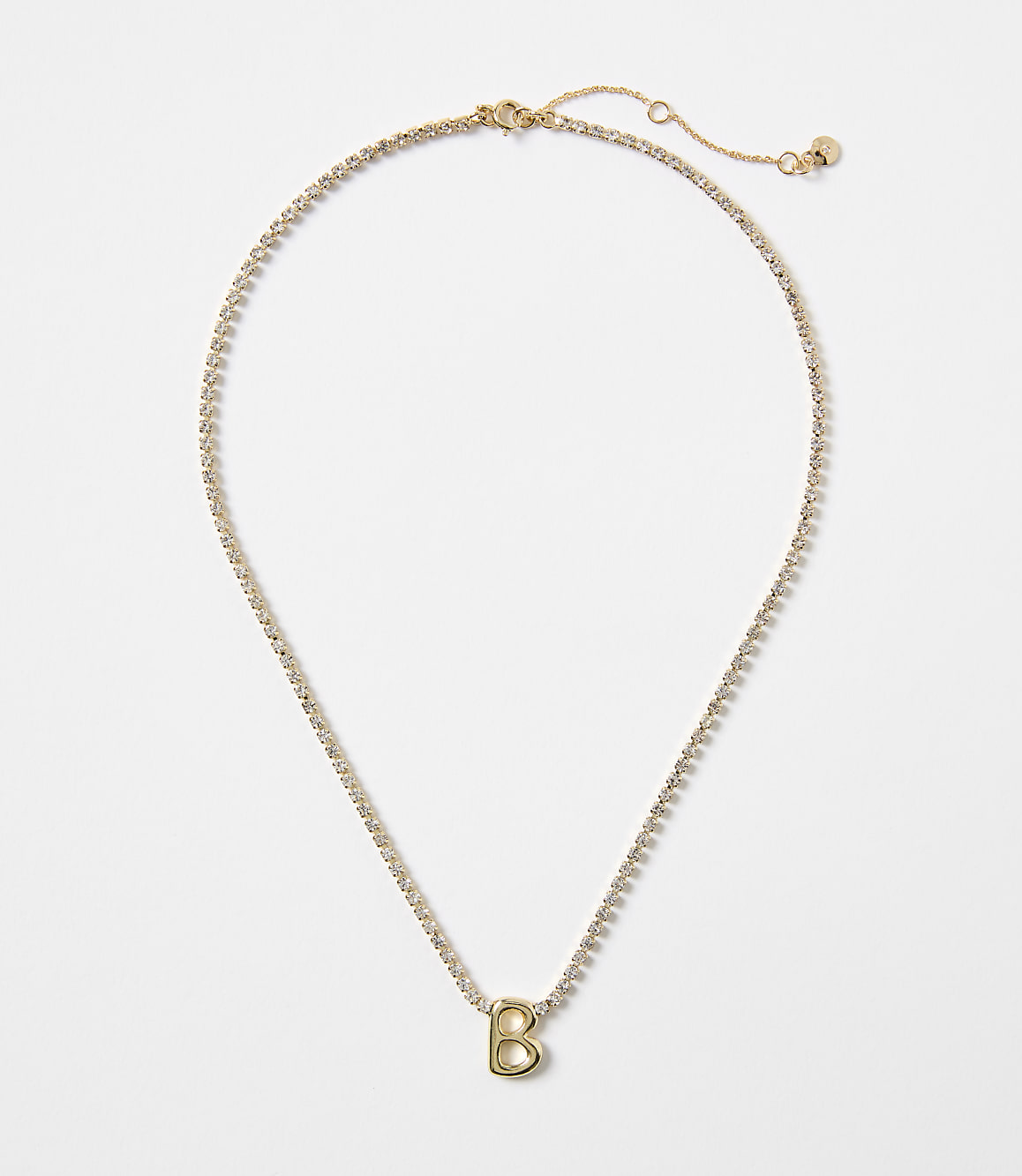 A gold necklace with a "B" charm and a white background.