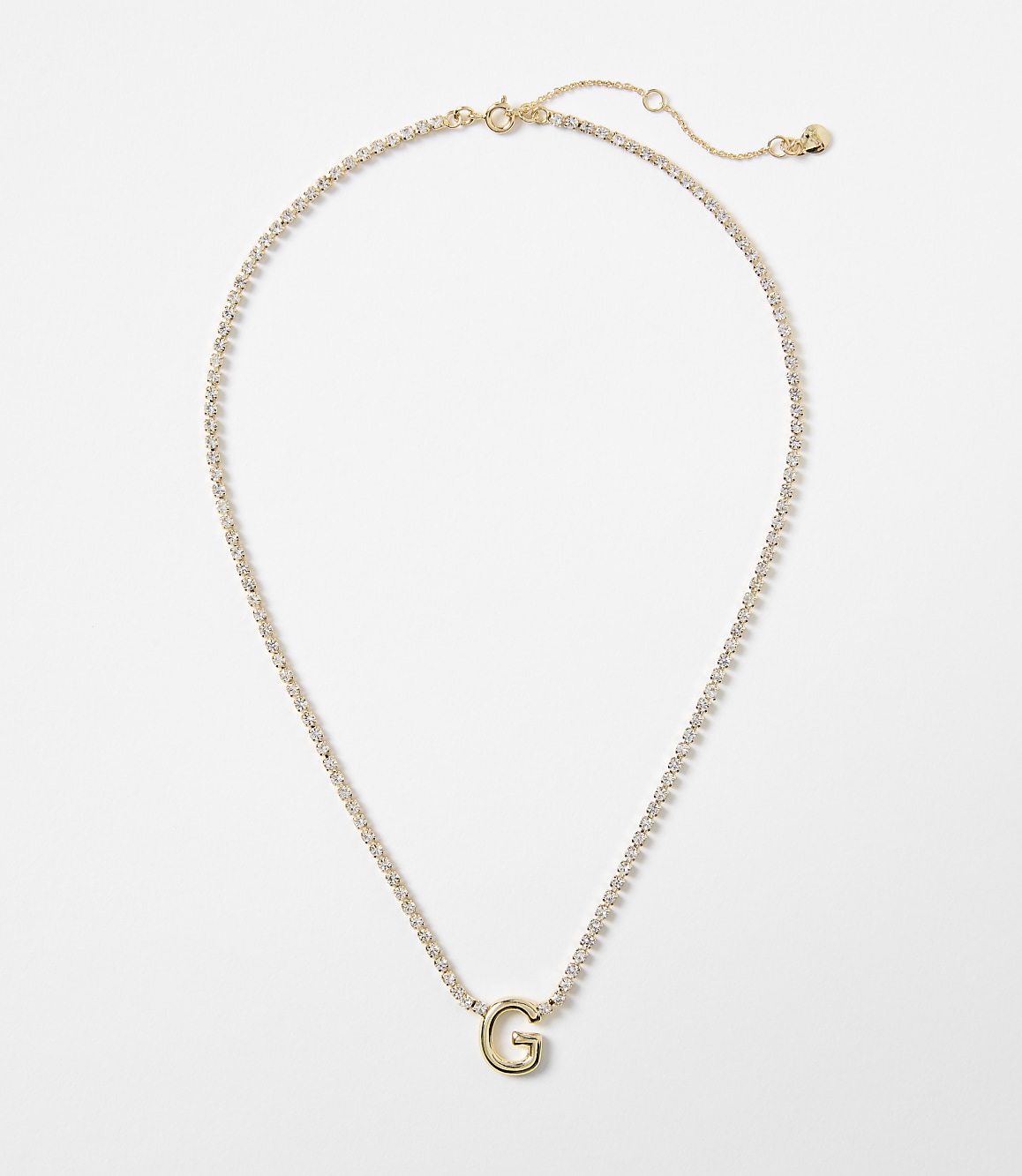 A gold necklace with a "G" pendant is displayed against a plain white background.