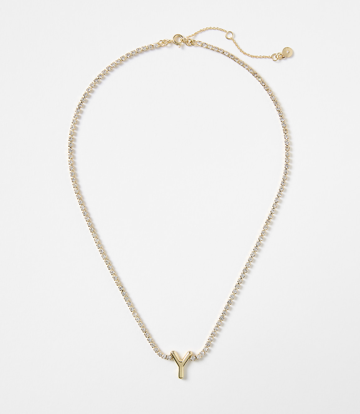 A gold letter "Y" pendant hangs from a delicate, sparkling chain against a plain white background.