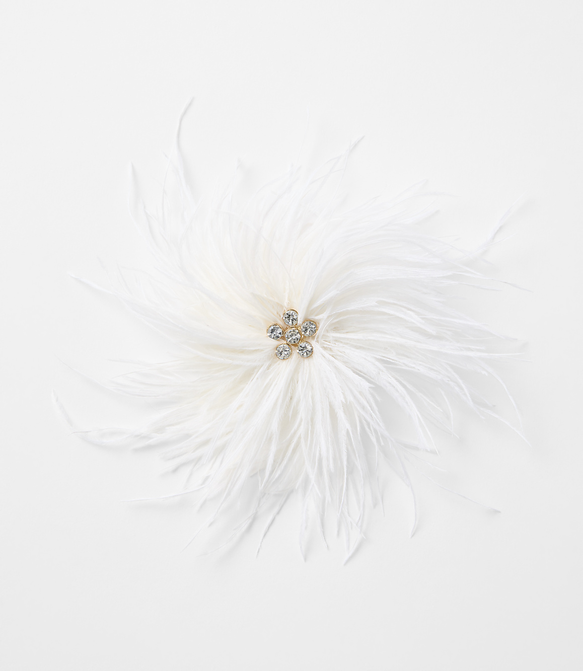A fluffy white feather adornment with a jeweled center rests on a plain white background.