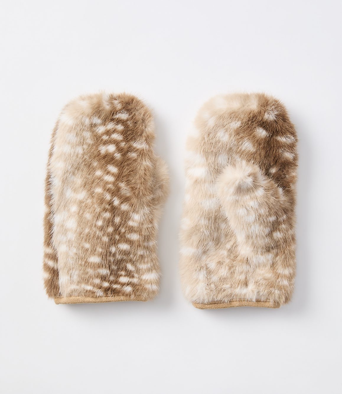 A pair of fuzzy, spotted mittens rests on a plain white background.