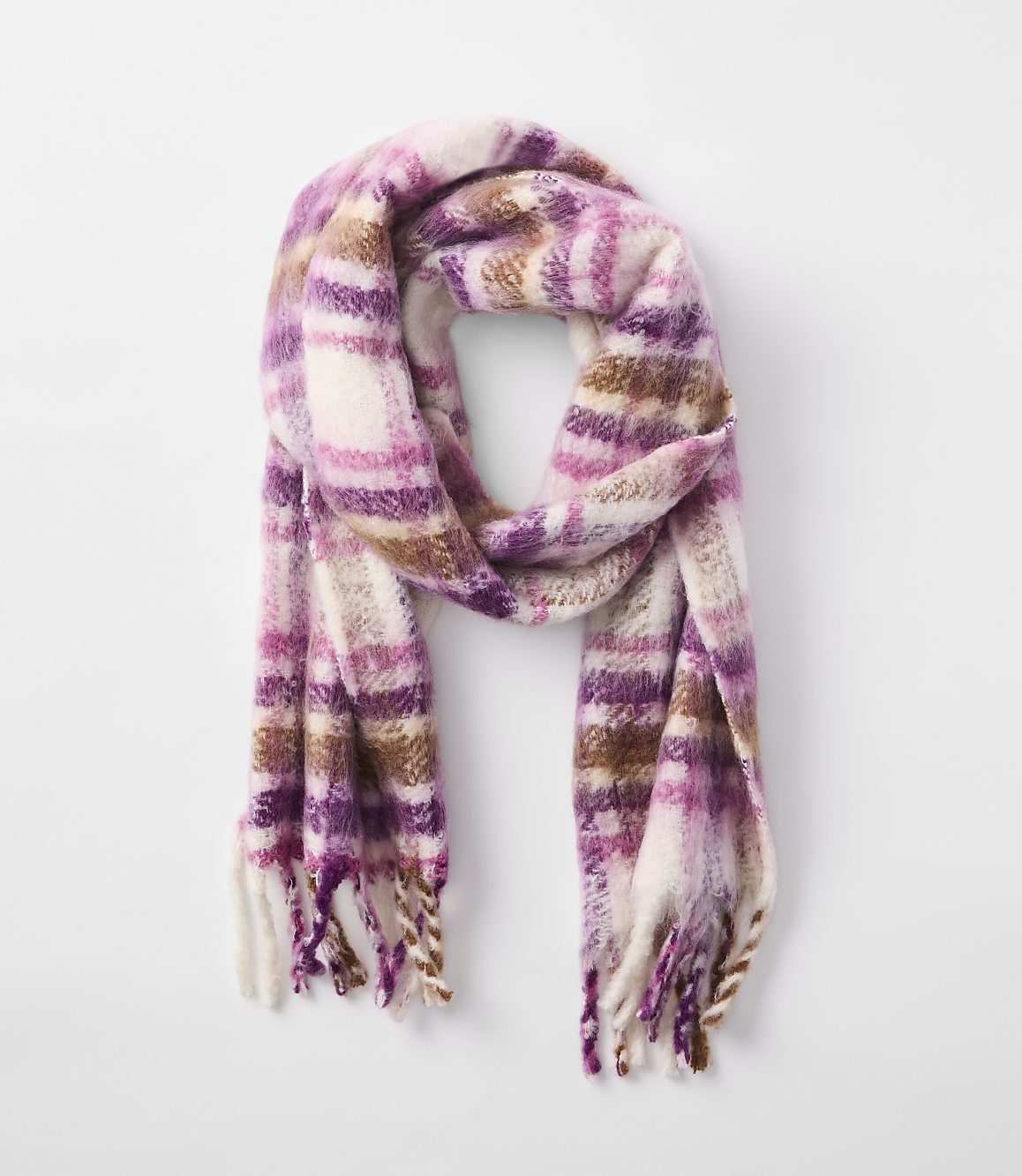 A fuzzy, plaid scarf in shades of pink, purple, and brown hangs against a plain white background.