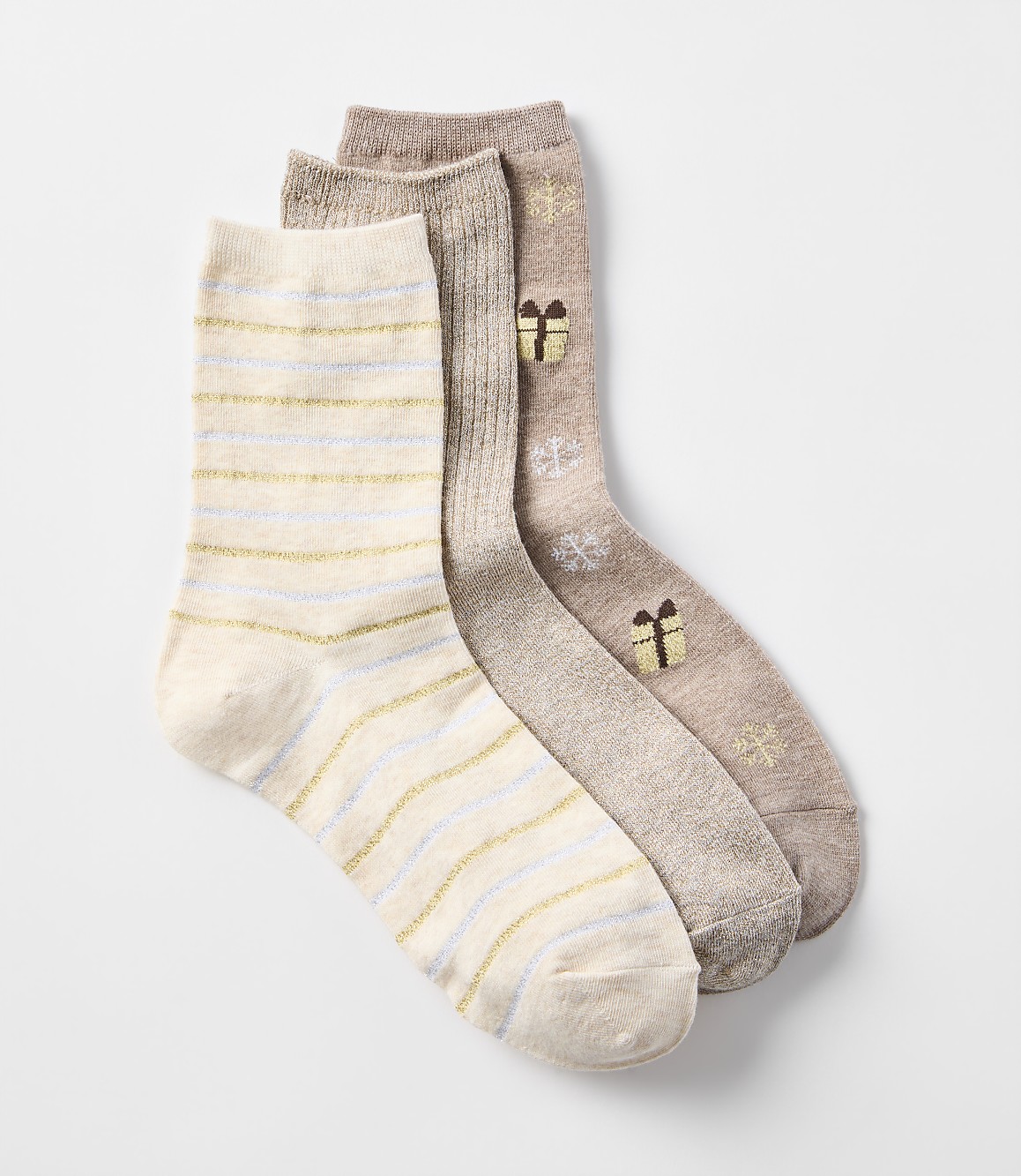 Three cozy socks, one with gold and blue stripes and two with a festive gift pattern, are arranged against a plain white background.