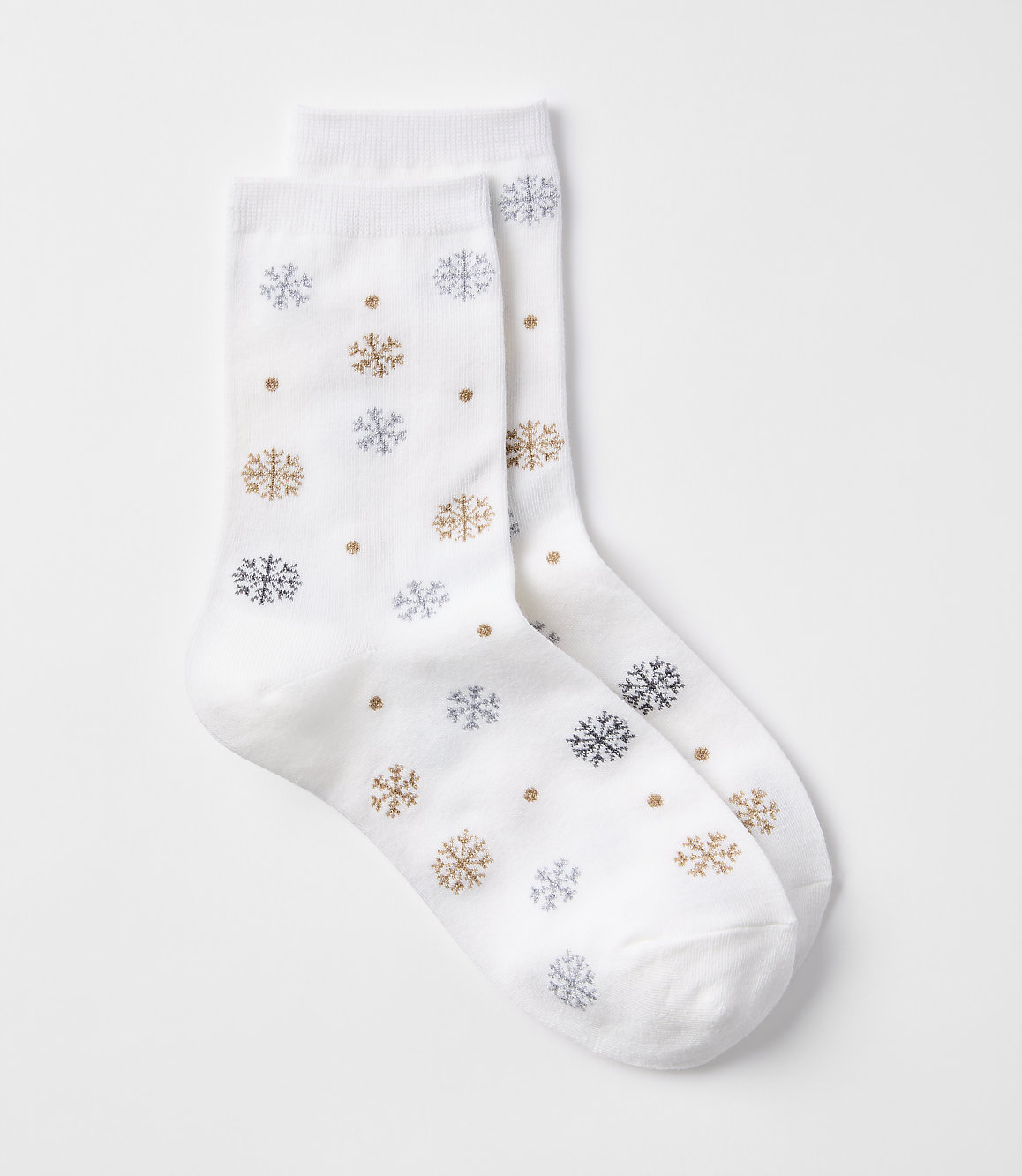 A pair of white socks with a snowflake pattern are laid out against a plain white background.