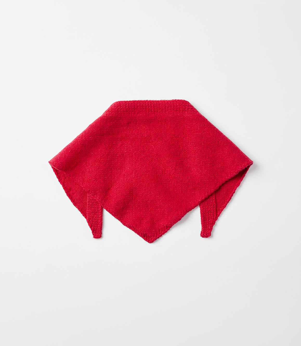 A red knitted bandana lies centered on a plain, light gray background.