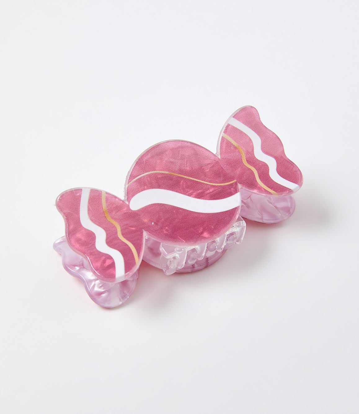 A pink candy-shaped accessory rests on a plain white background.