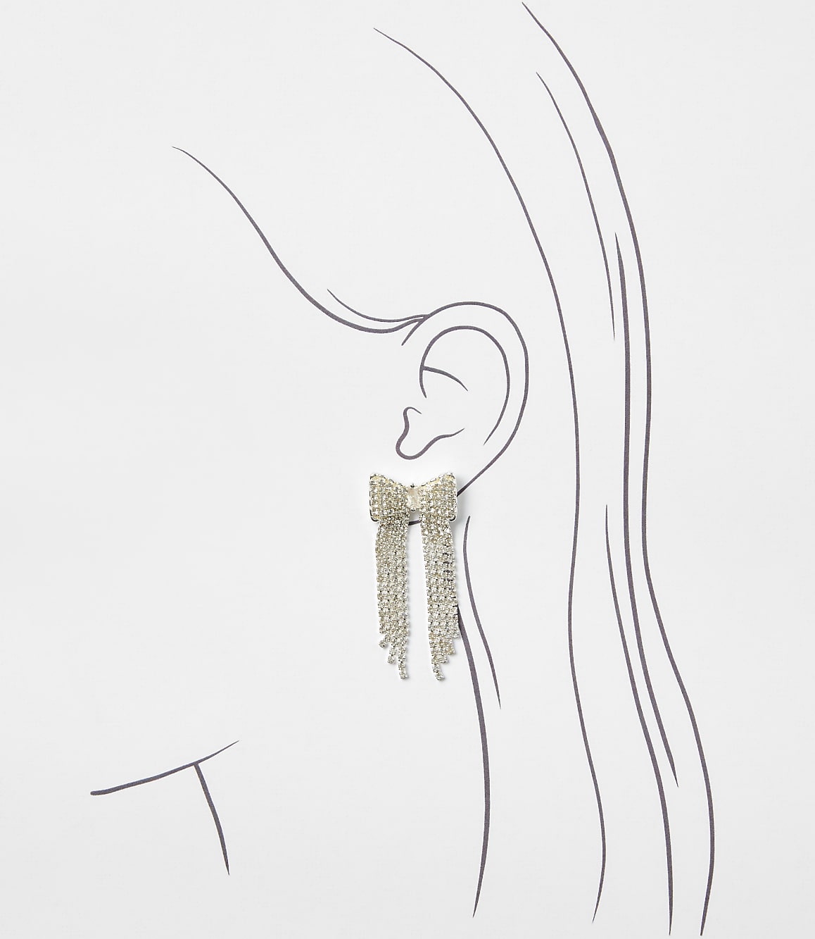 A sparkling bow-shaped earring with dangling crystal fringes is positioned against a minimalist line drawing of a woman's profile on a plain white background.
