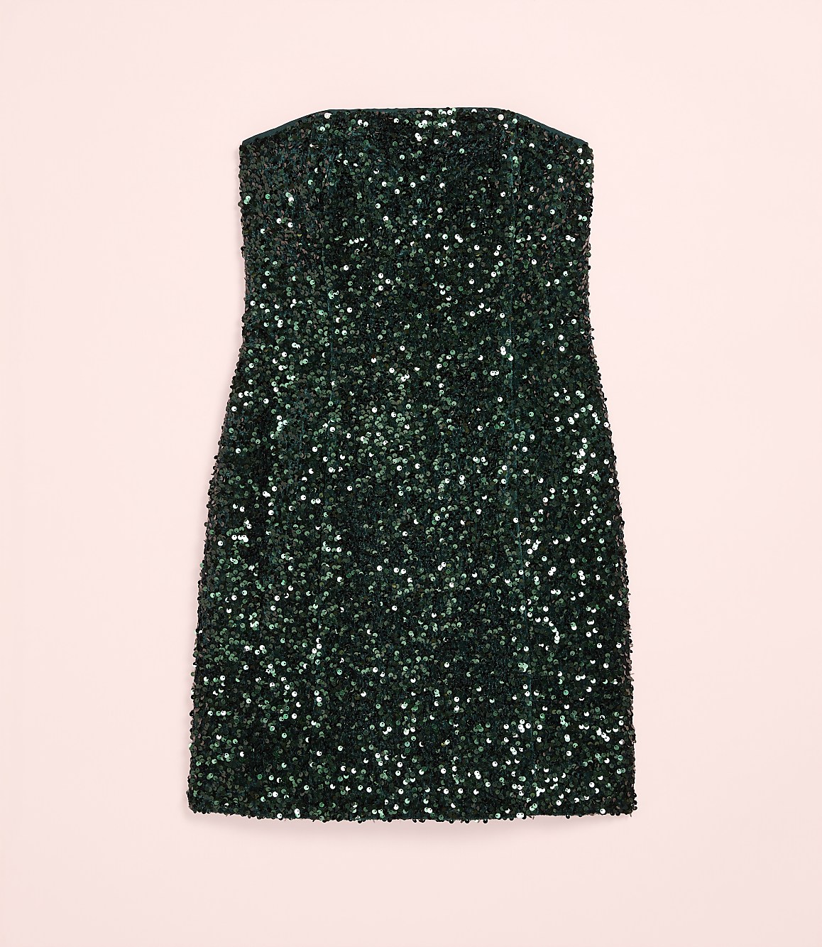 A sparkling dark green sequined mini dress is centered against a plain light pink background.