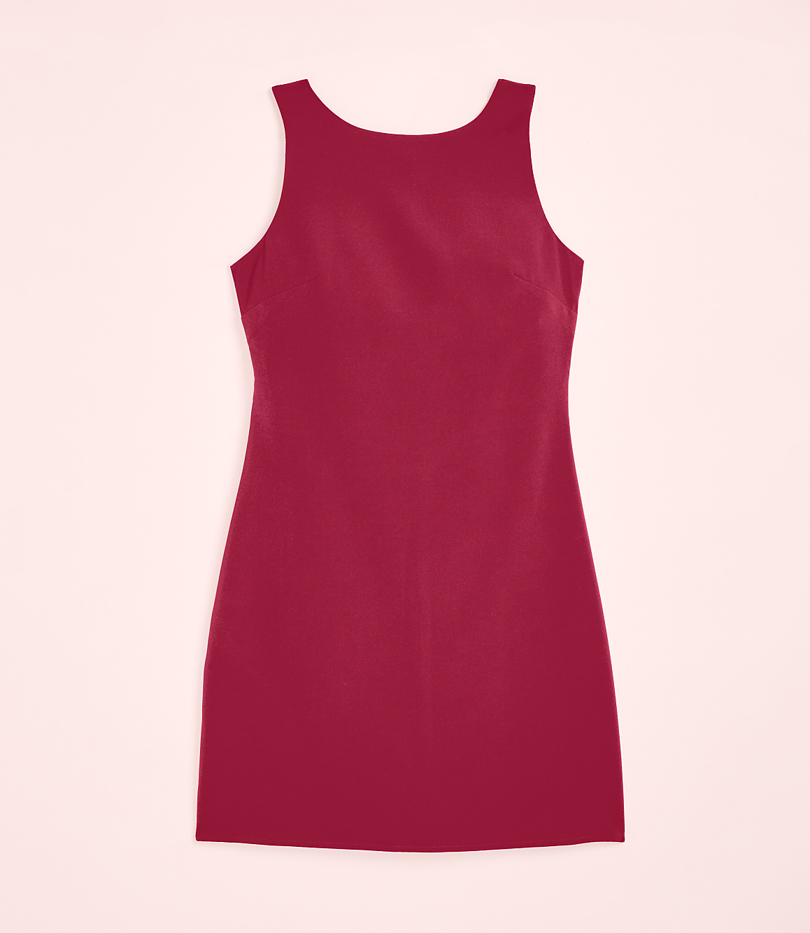 A sleeveless red mini dress is centered against a pale pink background.