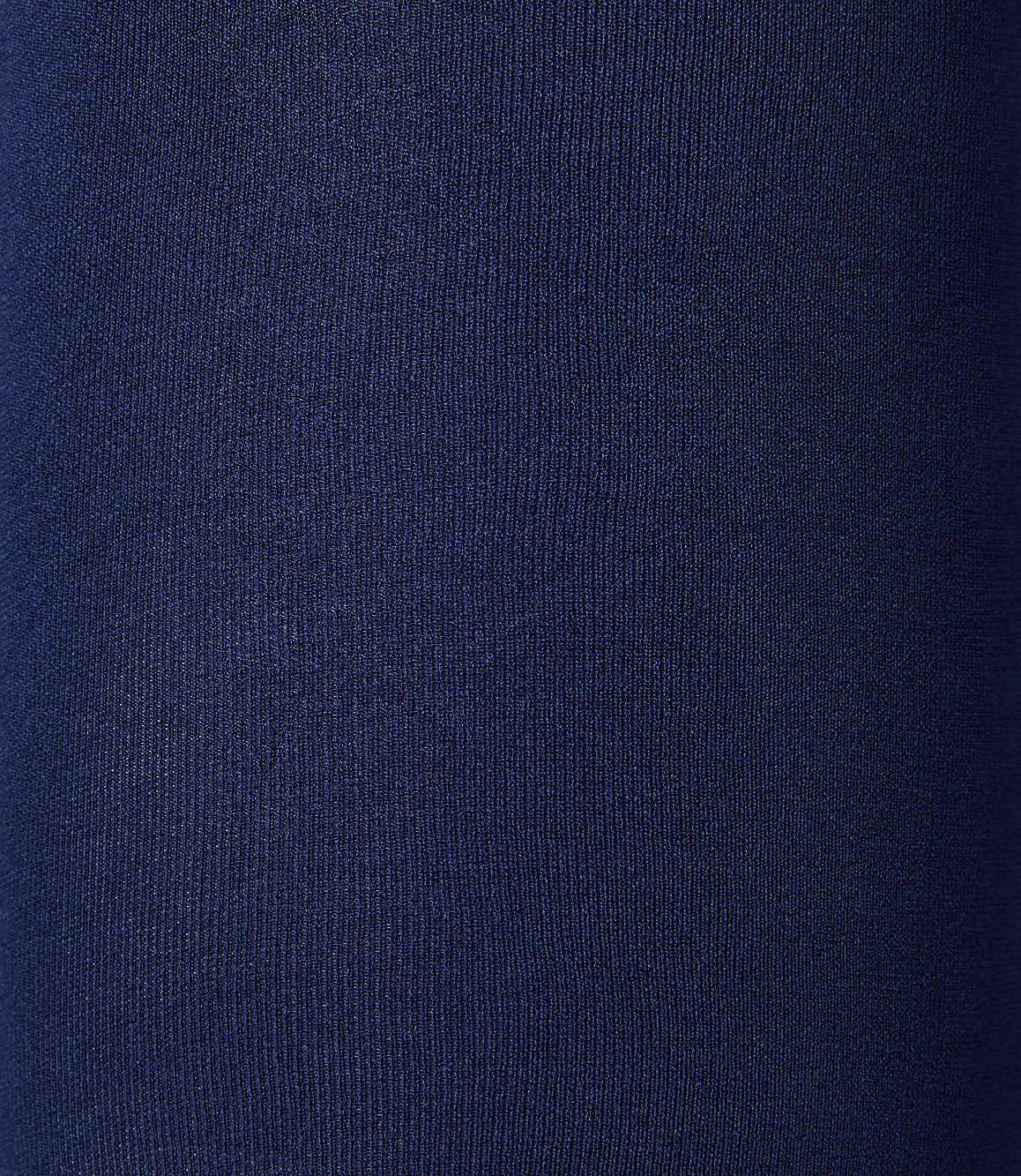 A close-up view of dark blue ribbed fabric fills the frame, with no discernible background.