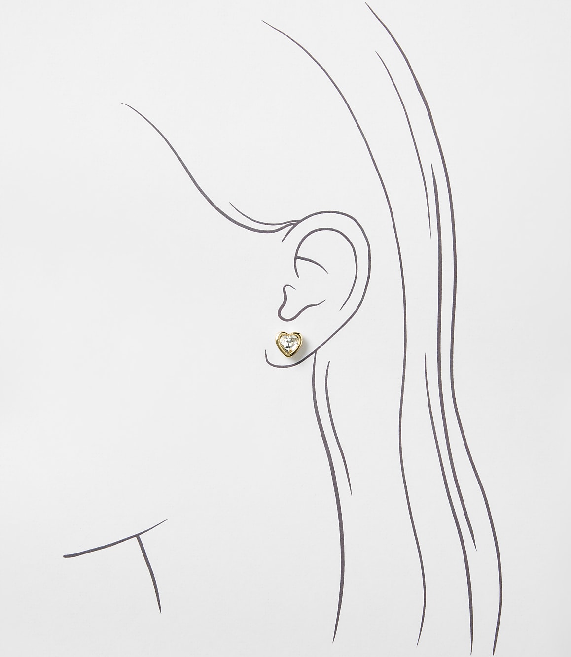 A small heart-shaped gold earring is placed on a simple line drawing of a woman's profile against a plain white background.