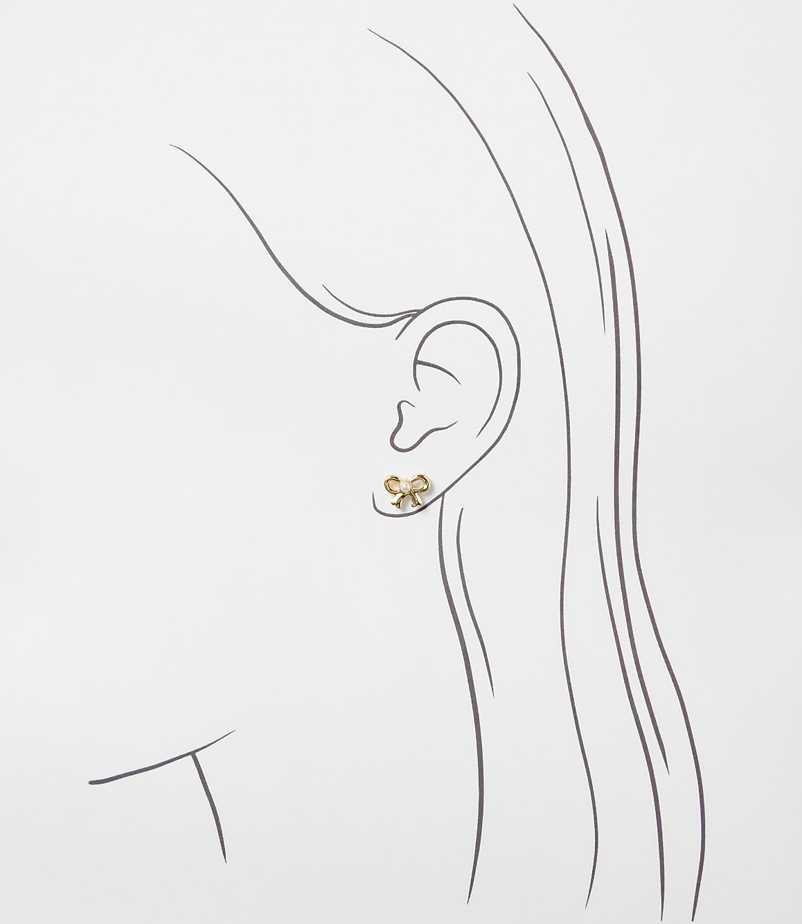 A gold bow-shaped earring is worn on the ear of a minimalist line drawing of a woman's profile against a plain white background.