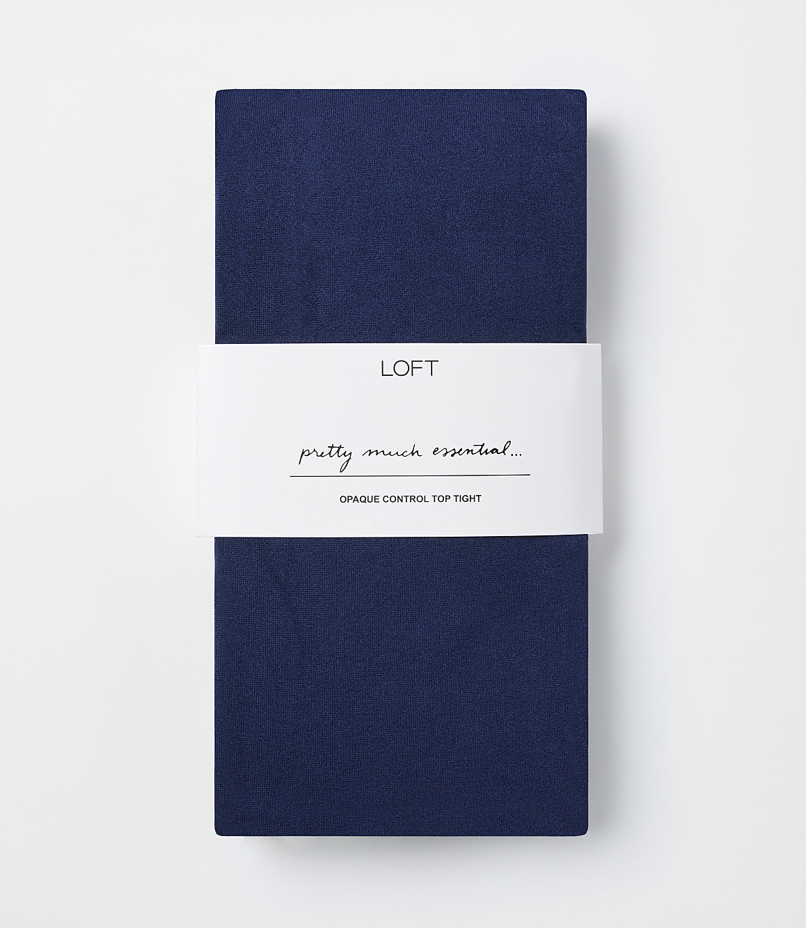 A folded pair of navy blue opaque control top tights with a white band in the middle featuring the "LOFT" logo and text, against a plain white background.