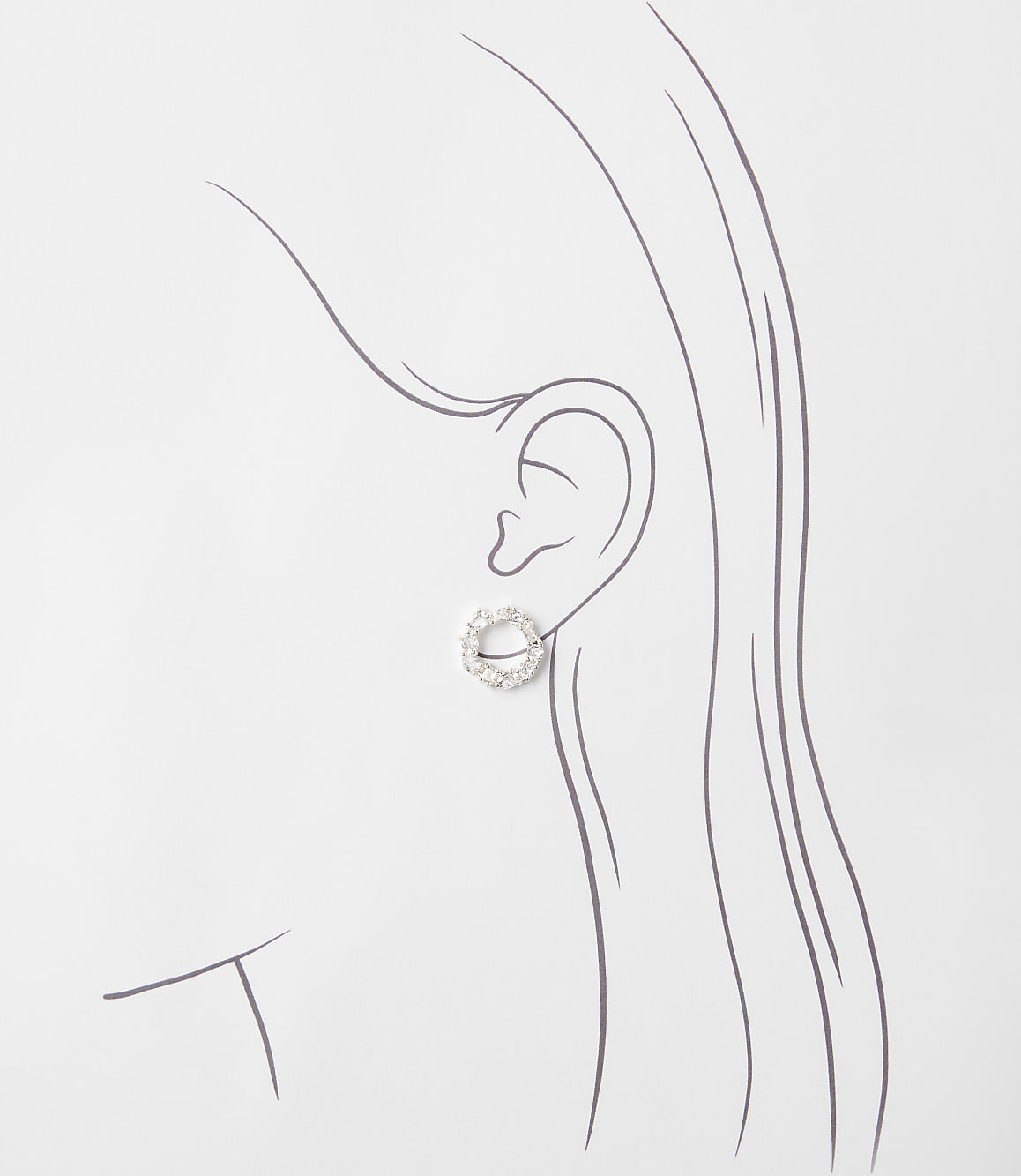 A sparkling circular earring is positioned on a minimalist line drawing of a woman's profile against a plain white background.