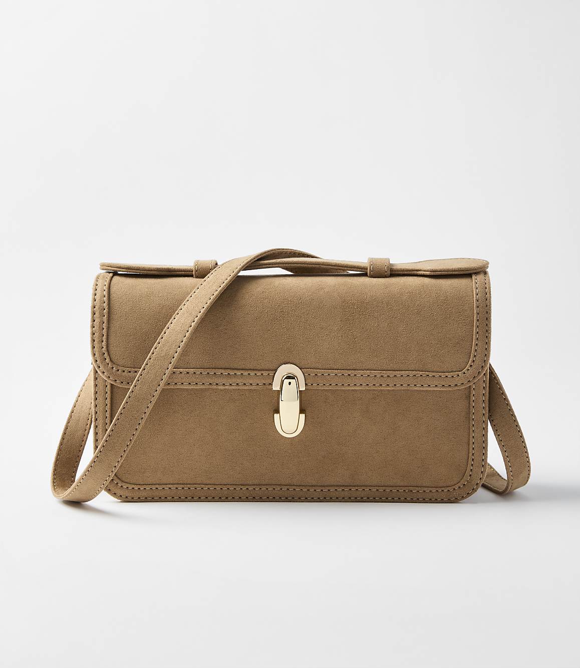 A tan suede crossbody bag with a gold clasp sits centered against a plain white background.
