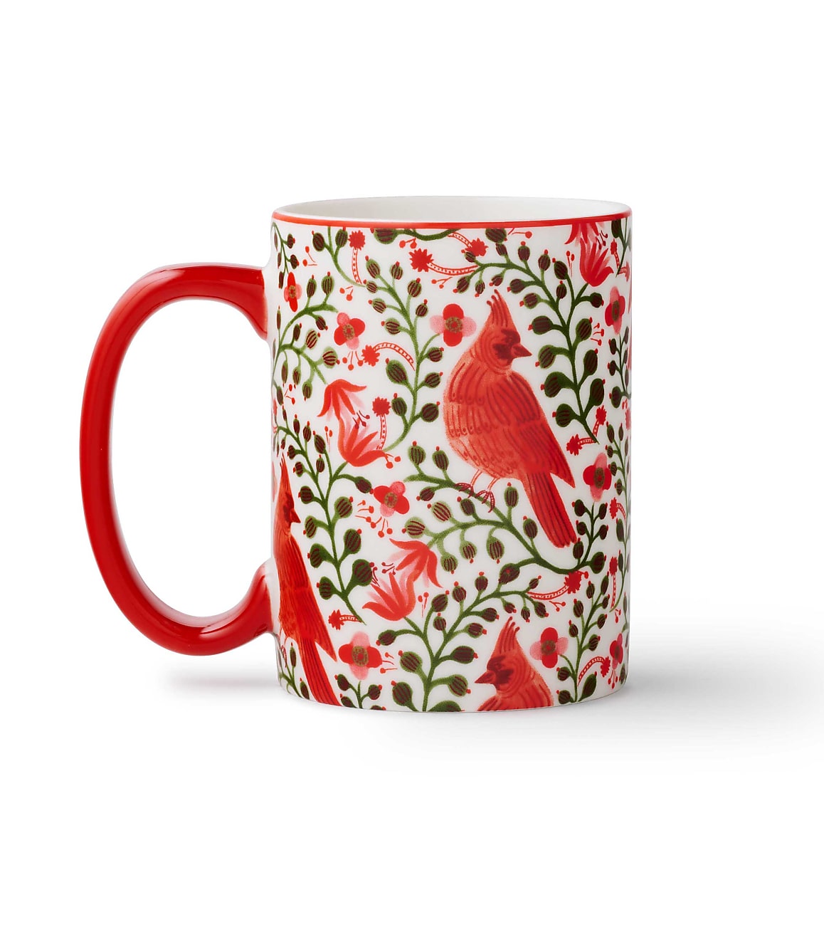 A white mug with a red handle and red cardinal and floral patterns sits against a plain white background.