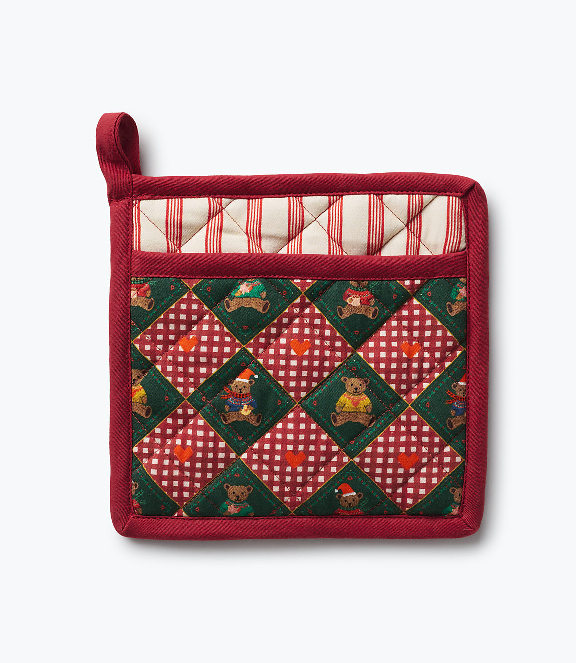 A red quilted pot holder with a teddy bear pattern sits against a plain white background.
